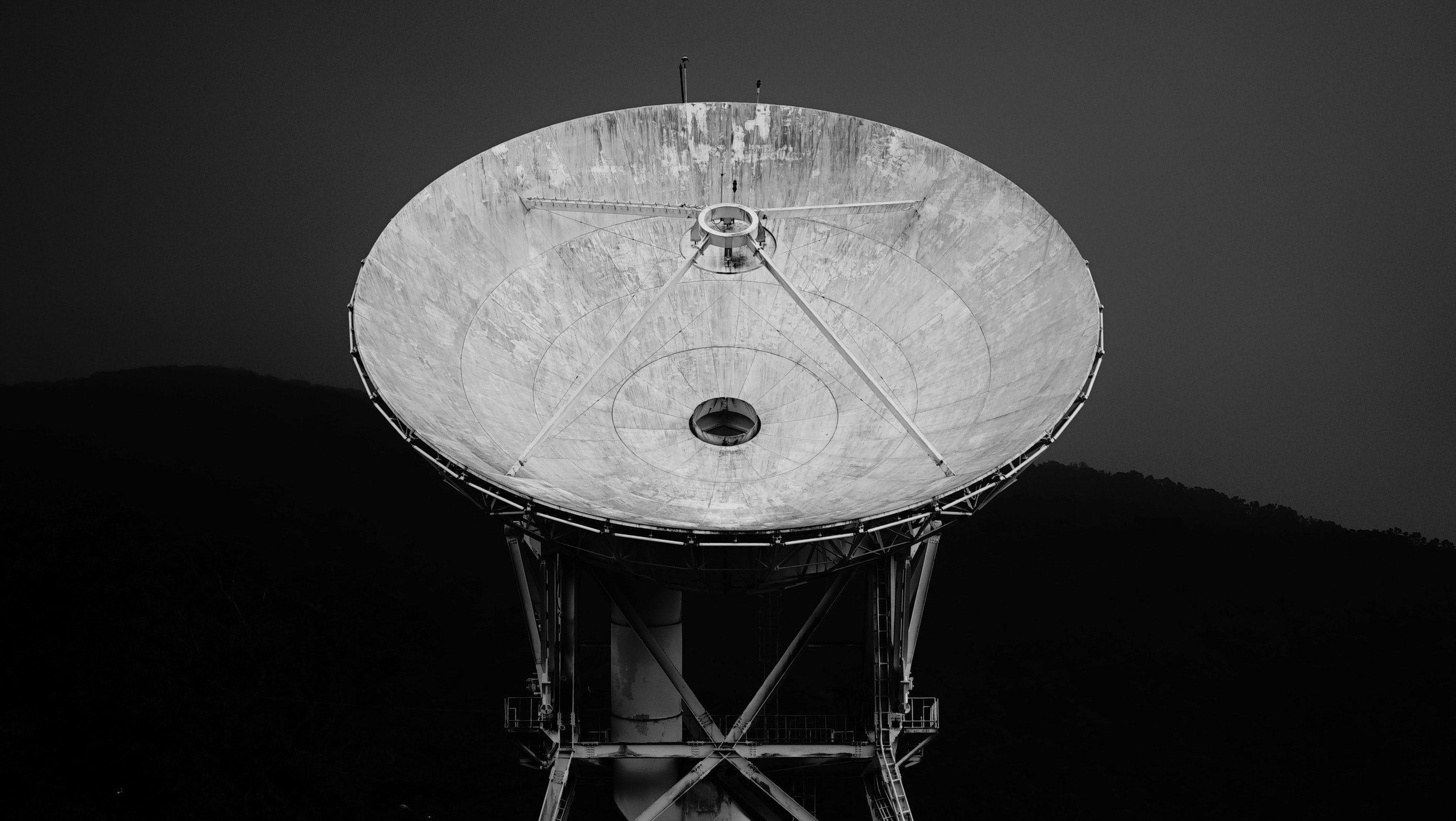 2768x1560 Wallpaper / a black and white shot of a dish radio telescope, satellite antenna skyward 4k wallpaper