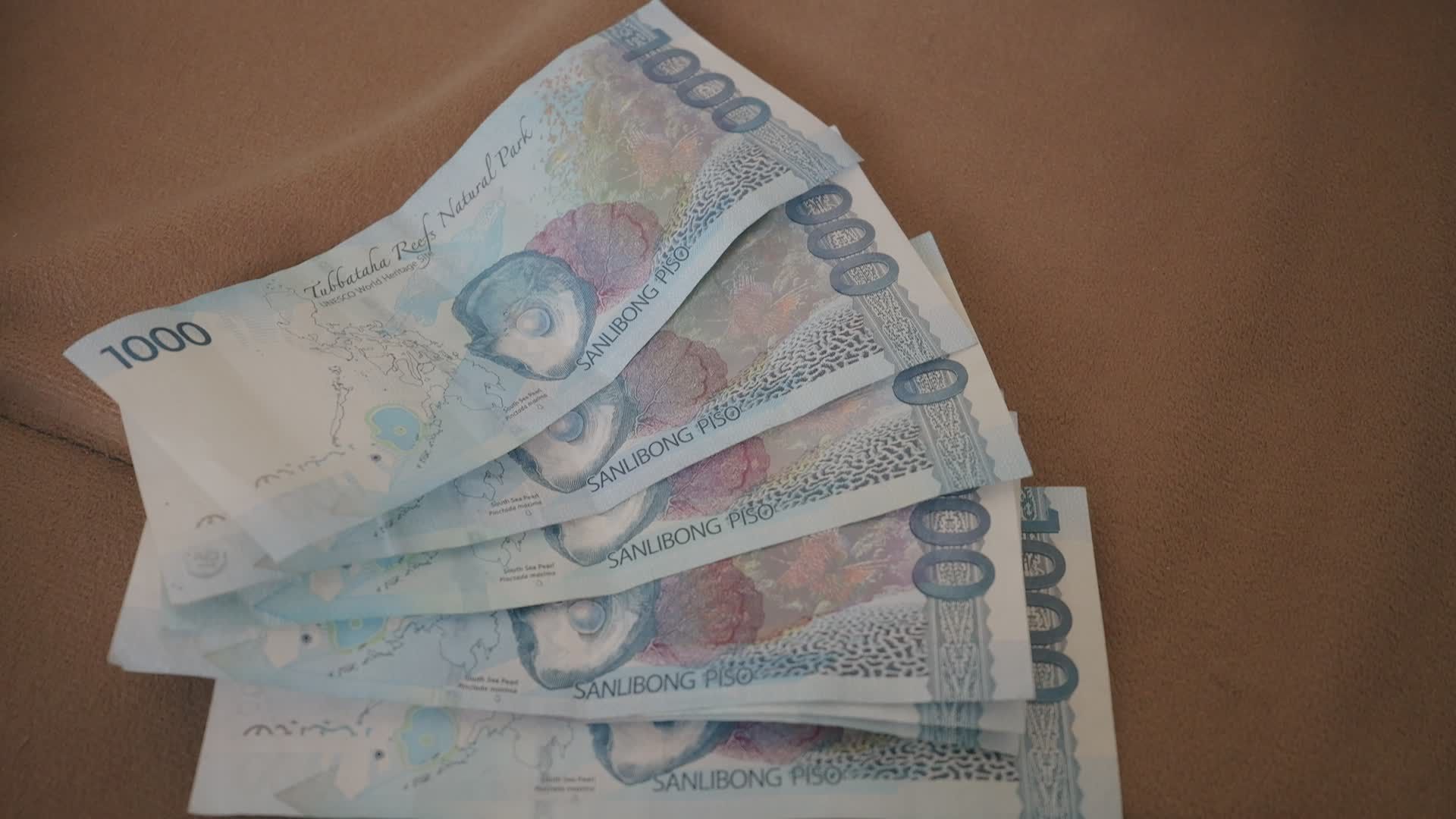 1920x1080 Stack Of 1000 Philippine Peso Bills On Fabric Free Stock Video Footage, Royalty Free 4K & HD Video Clip