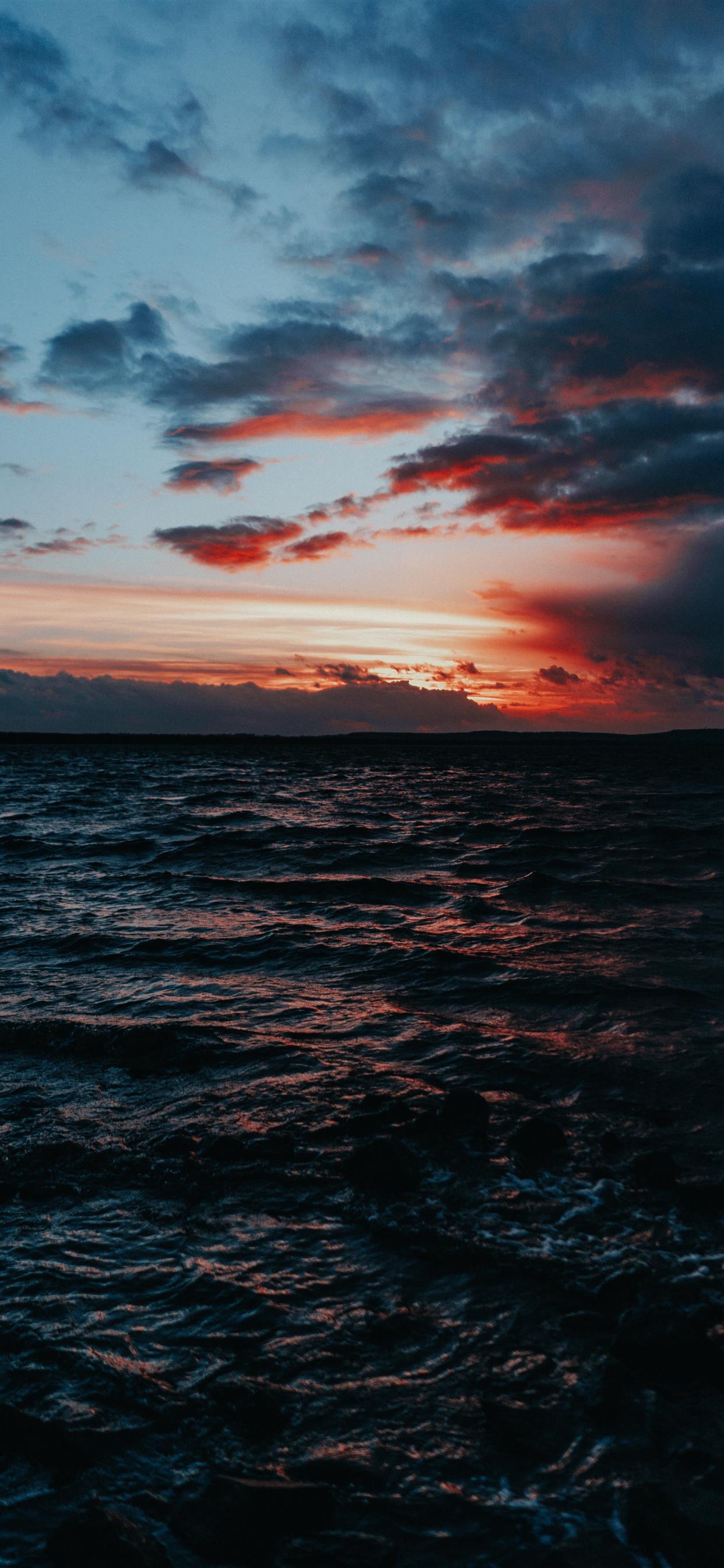 1242x2688 body of water under grey sky iPhone 11 Wallpaper Free Download