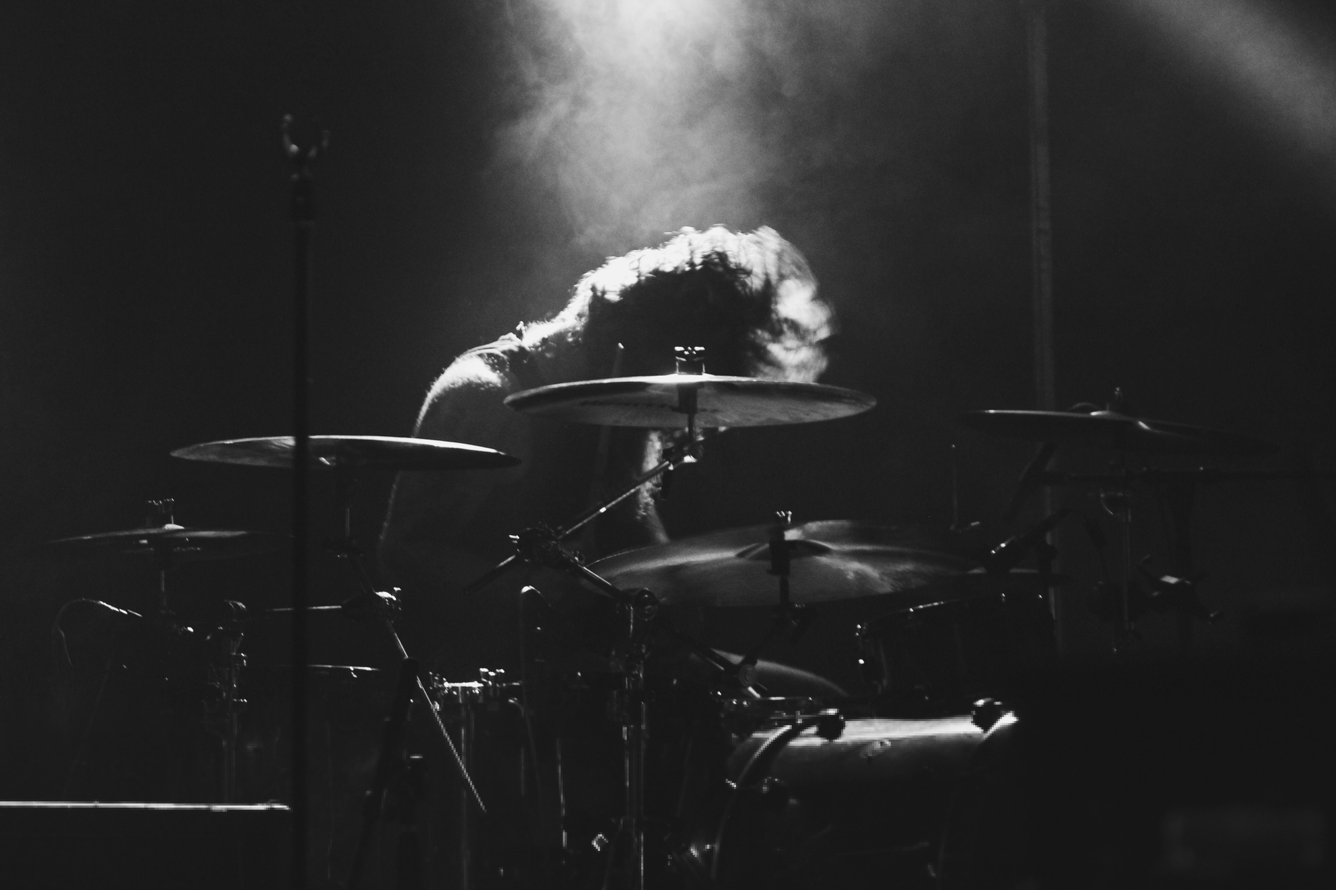 5184x3456 grayscale photo of man playing drum free image