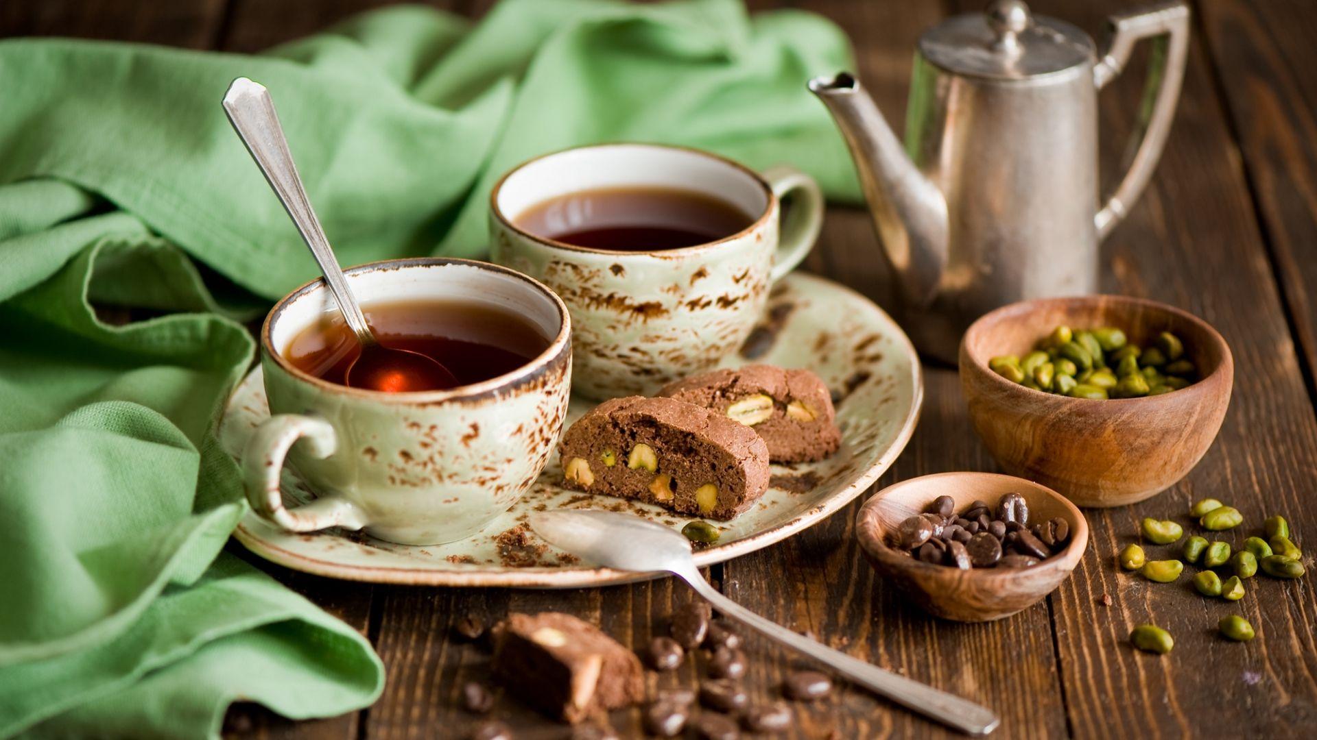 1920x1080 Wallpaper coffee, cups, spoons, pistachios, corn, biscuit, chocolate, dessert, sweet, plate