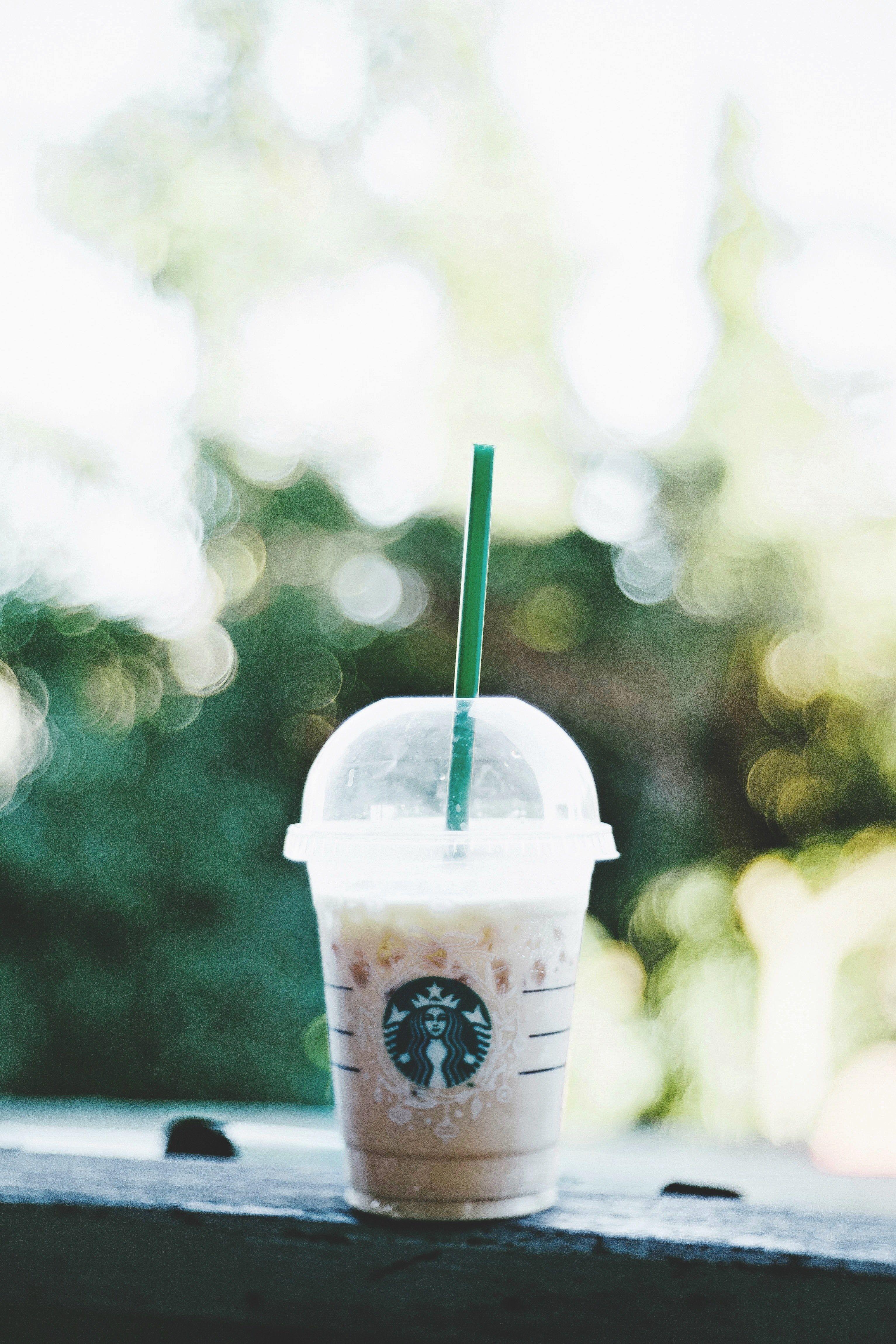 3066x4599 Wallpaper / iced starbucks coffee frappuccino with cream on a patio ledge, coffee 4k wallpaper
