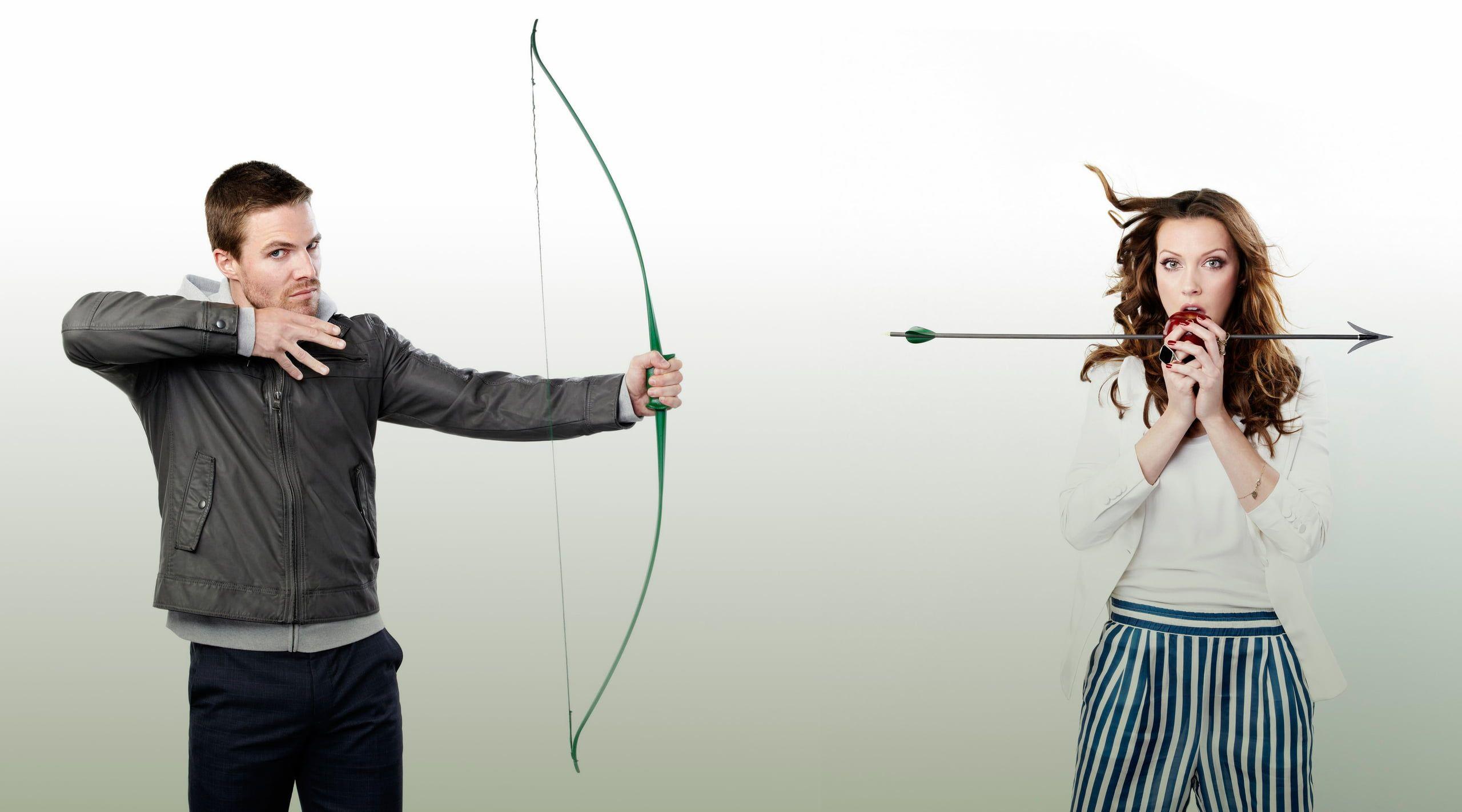 2560x1422 Man holding bow and woman holding arrow photo HD wallpaper