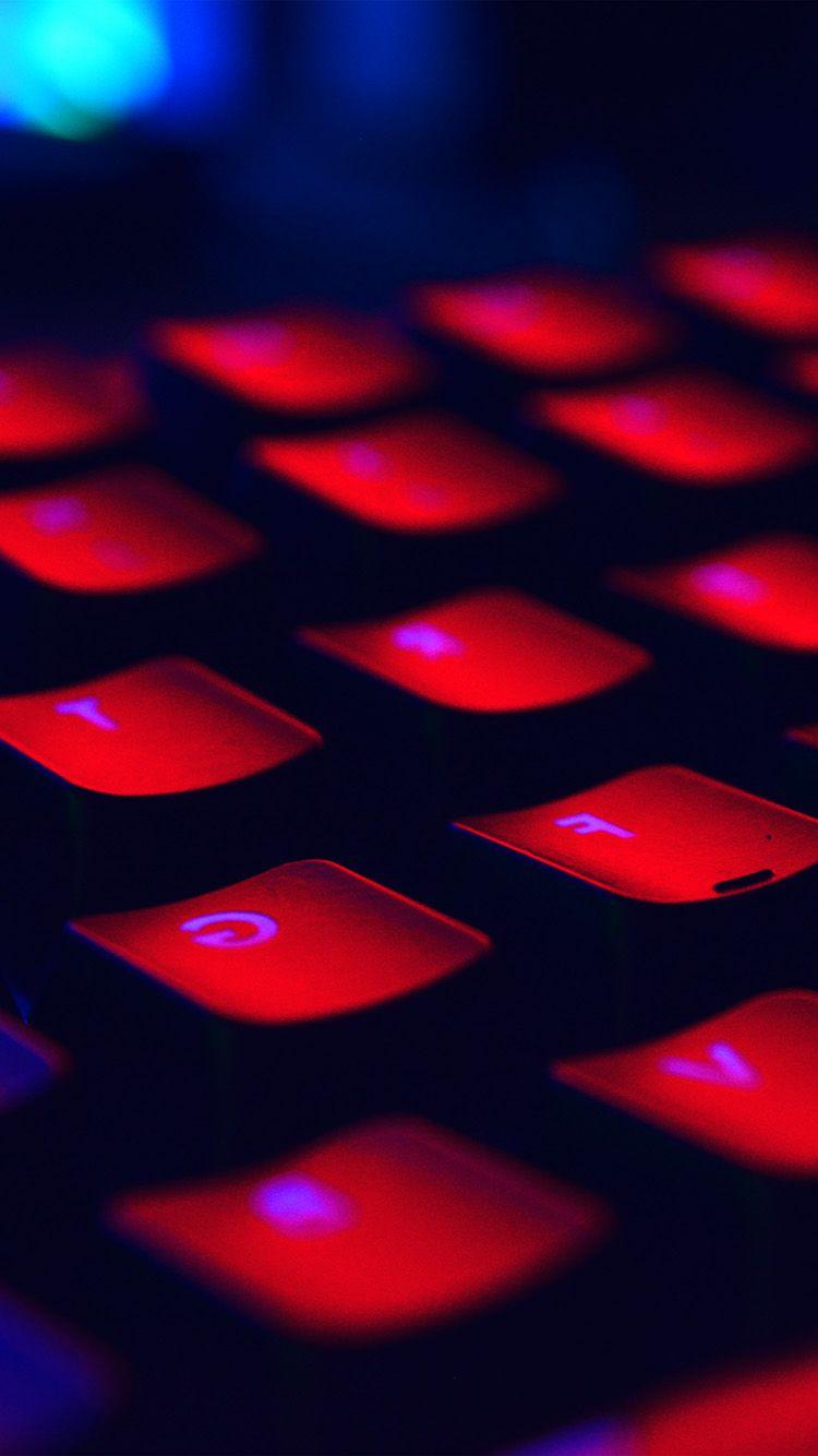 750x1334 iPhone X wallpaper. dark red keyboard coding blue