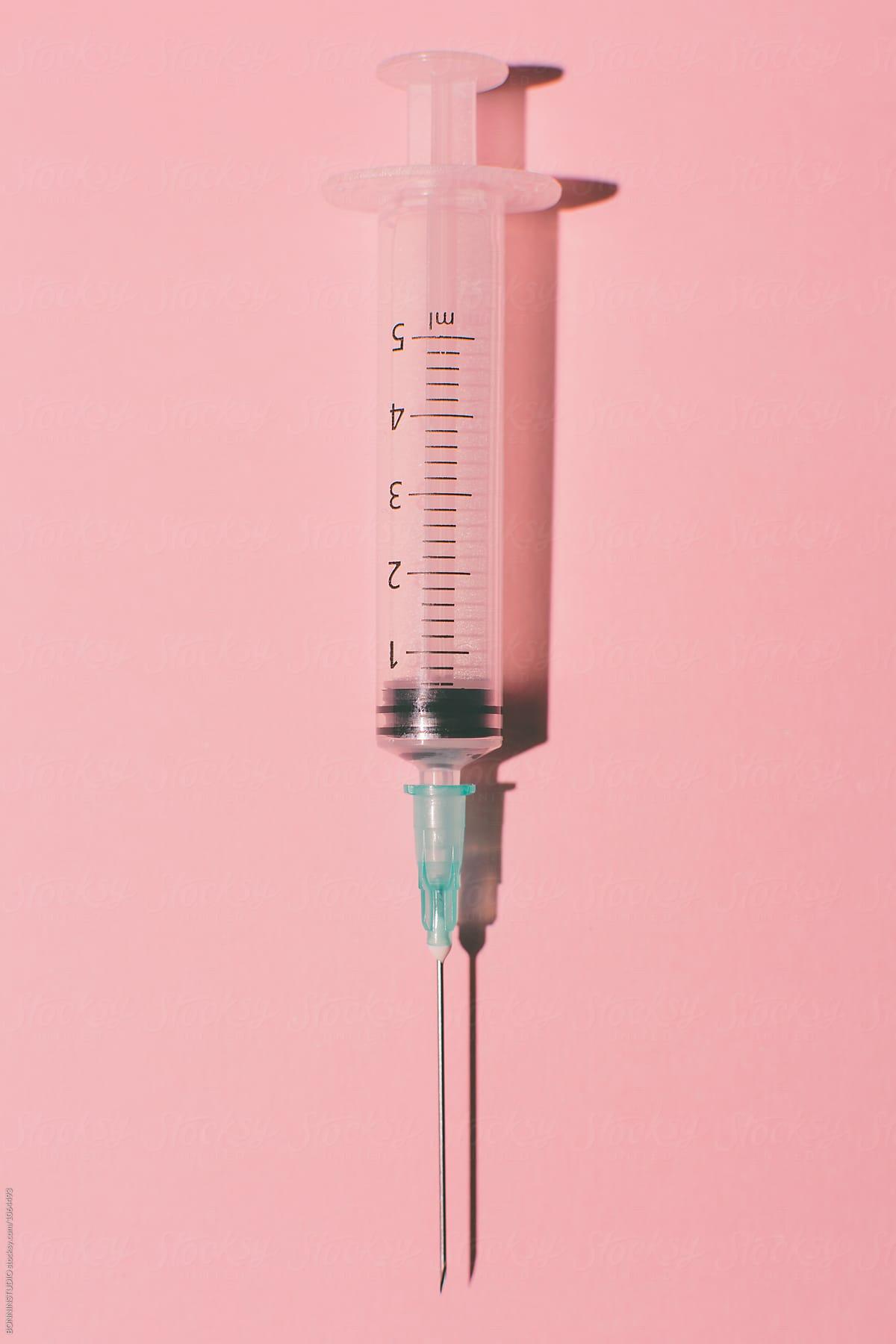1200x1800 Syringe on pink background from above. by BONNINSTUDIO, Syringe
