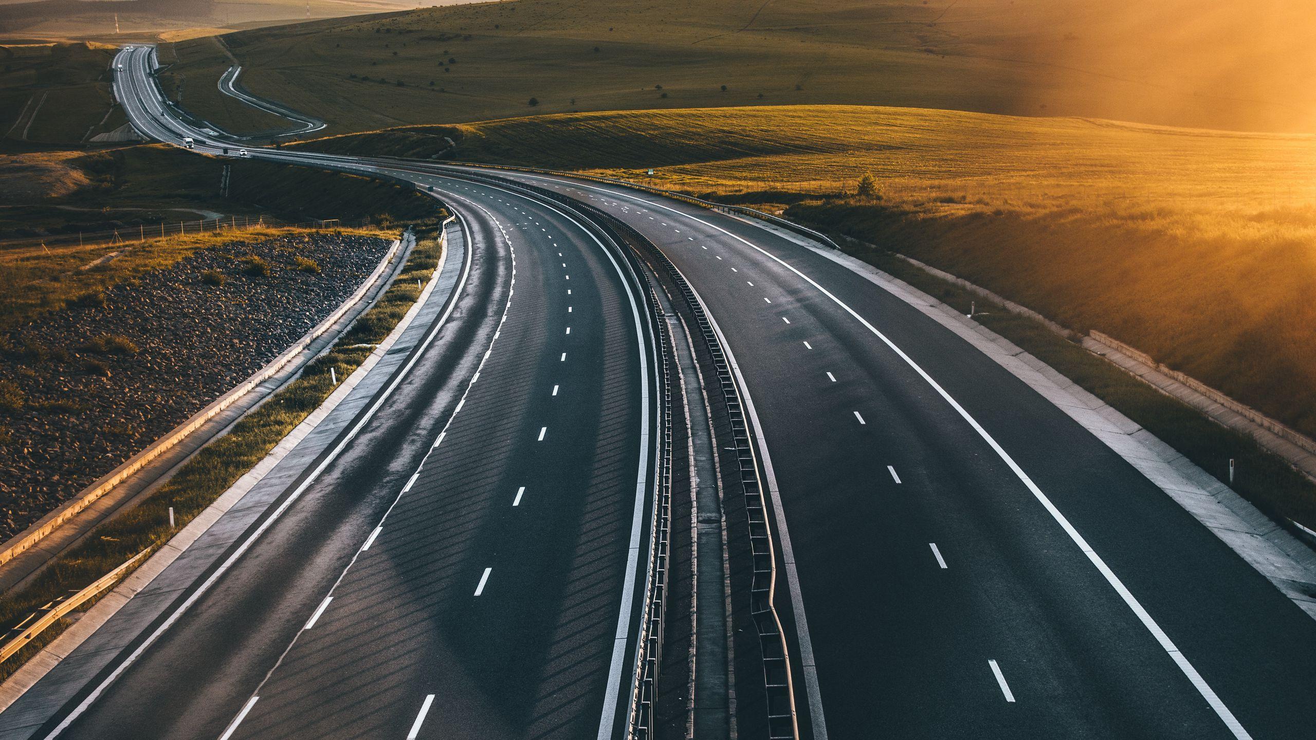 2560x1440 Download wallpaper 2560x1440 road, marking, asphalt, sunset widescreen 16:9 HD background