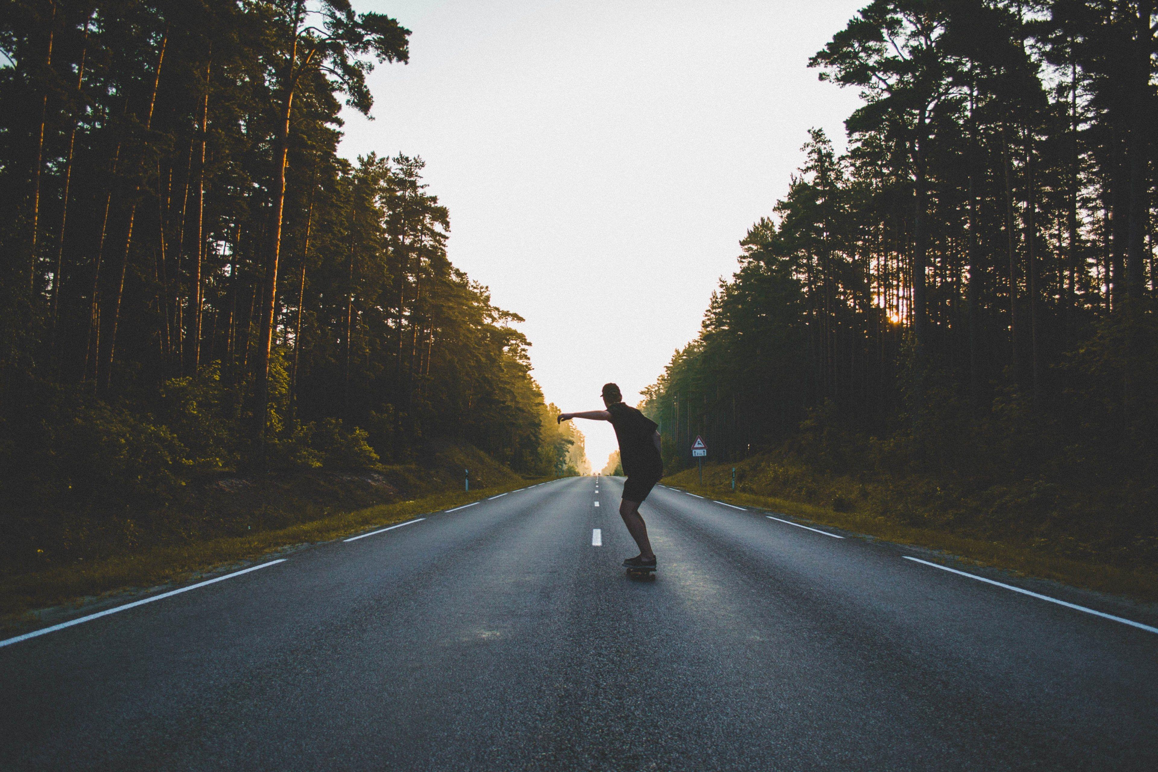 3840x2560 Wallpaper / man skateboarding on asphalt next to forest during sunset, skateboarding road on sunset 4k wallpaper