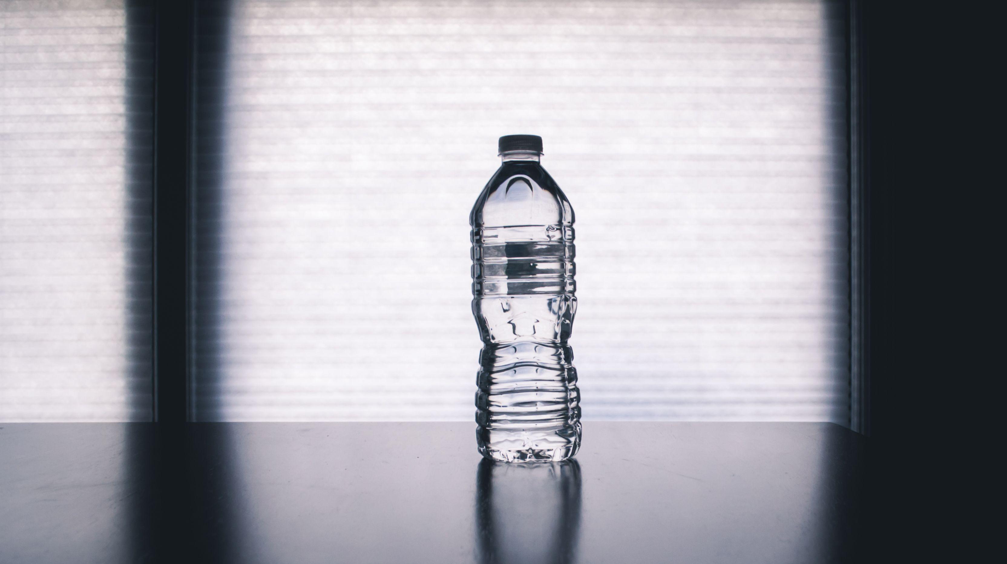 3328x1864 Clear Disposable Bottle on Black Surface · Free