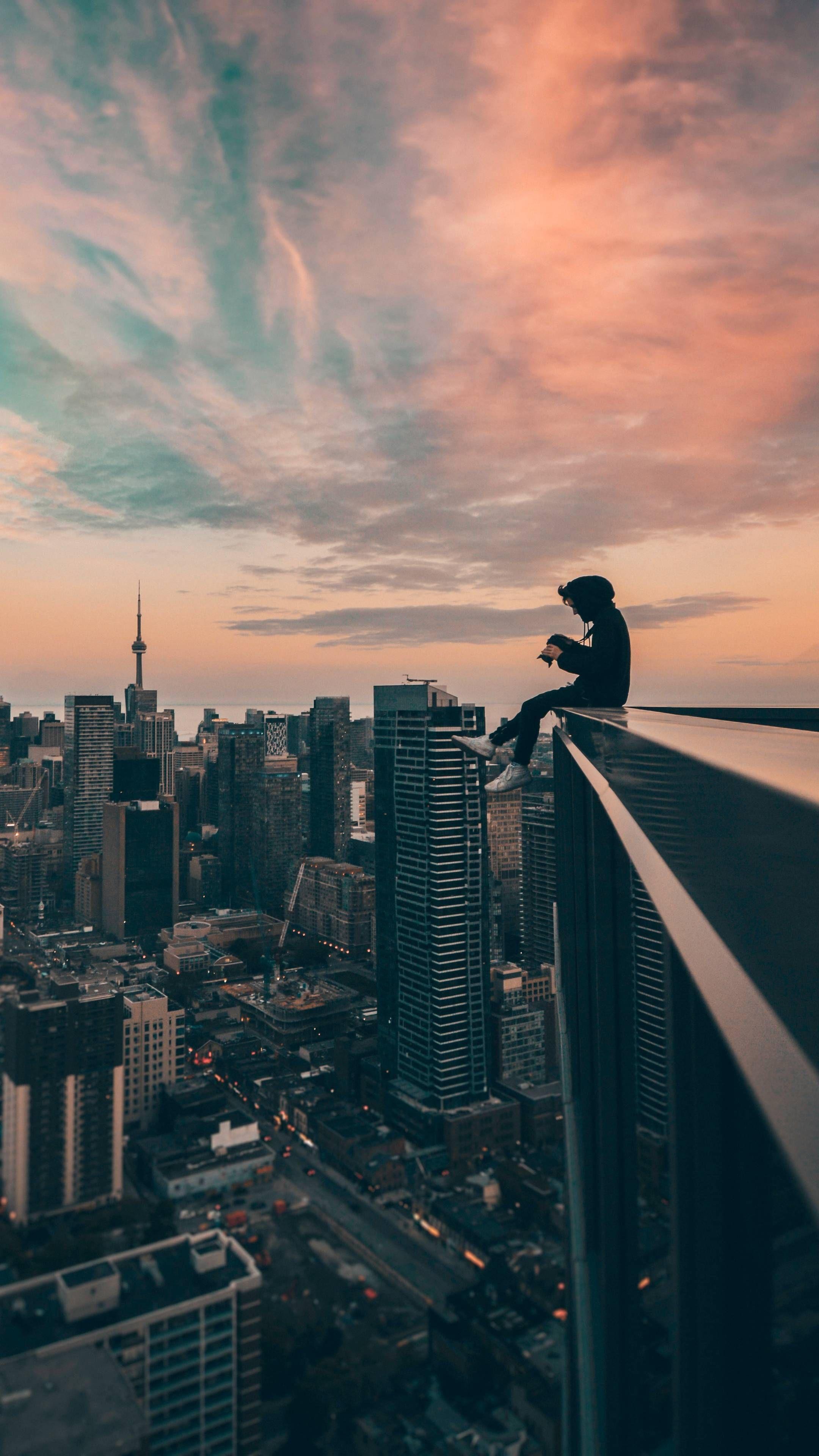 2160x3840 A Man Sitting on Top of a Building. Phone wallpaper for men, Anime scenery, Beautiful wallpaper background