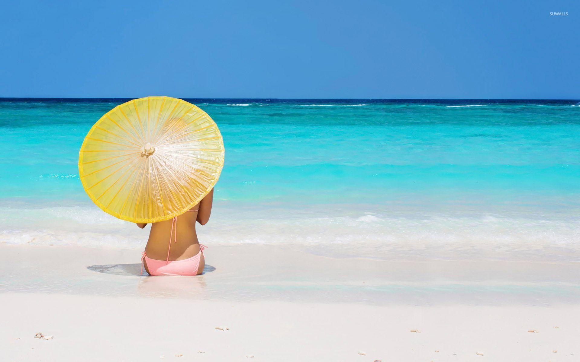 1920x1200 Girl with a yellow umbrella in the sand wallpaper wallpaper