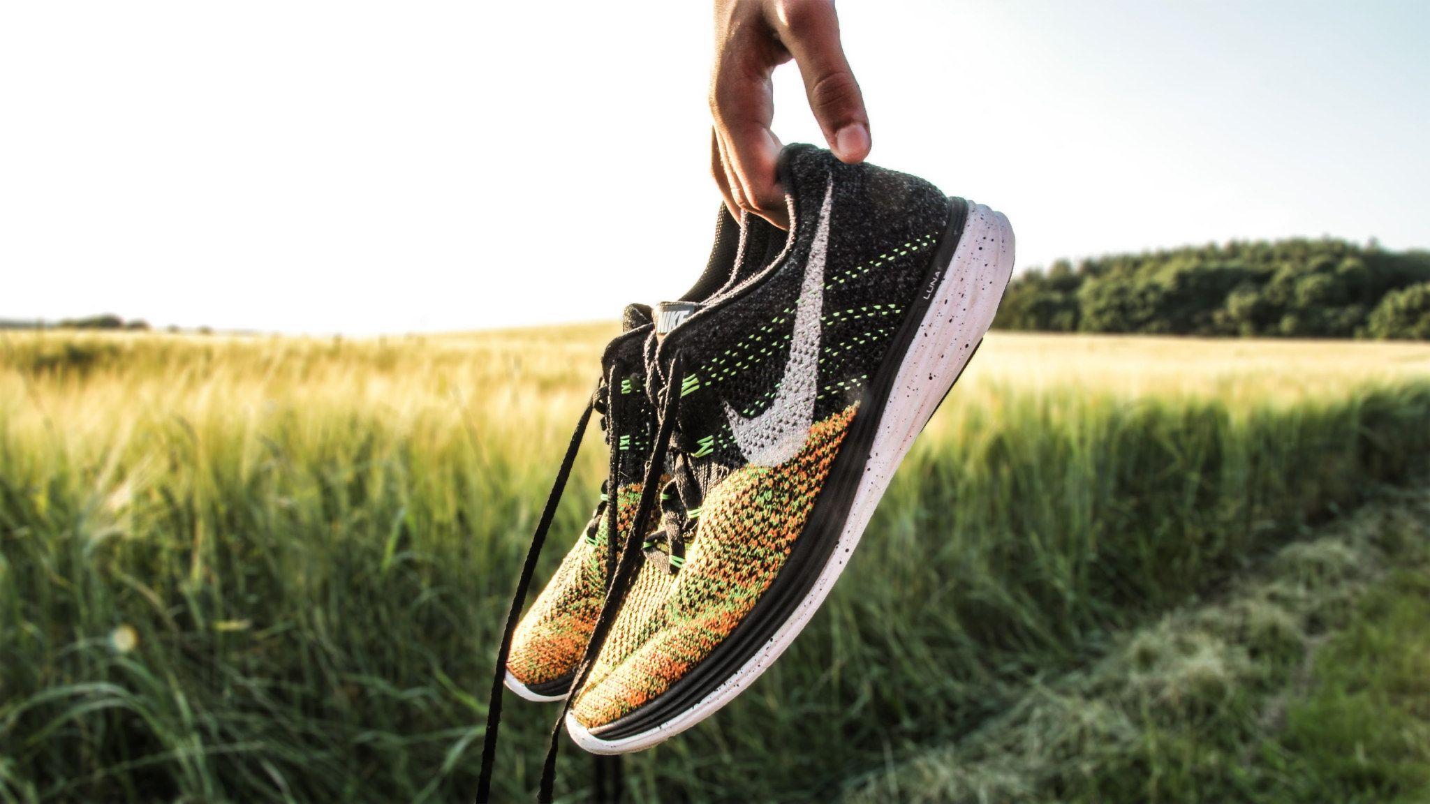 2048x1152 Dope Wallpaper • Wallpaper Person Holding Pair Of Black And Yellow Nike Running Shoes • Wallpaper For You The Best Wallpaper For Desktop & Mobile