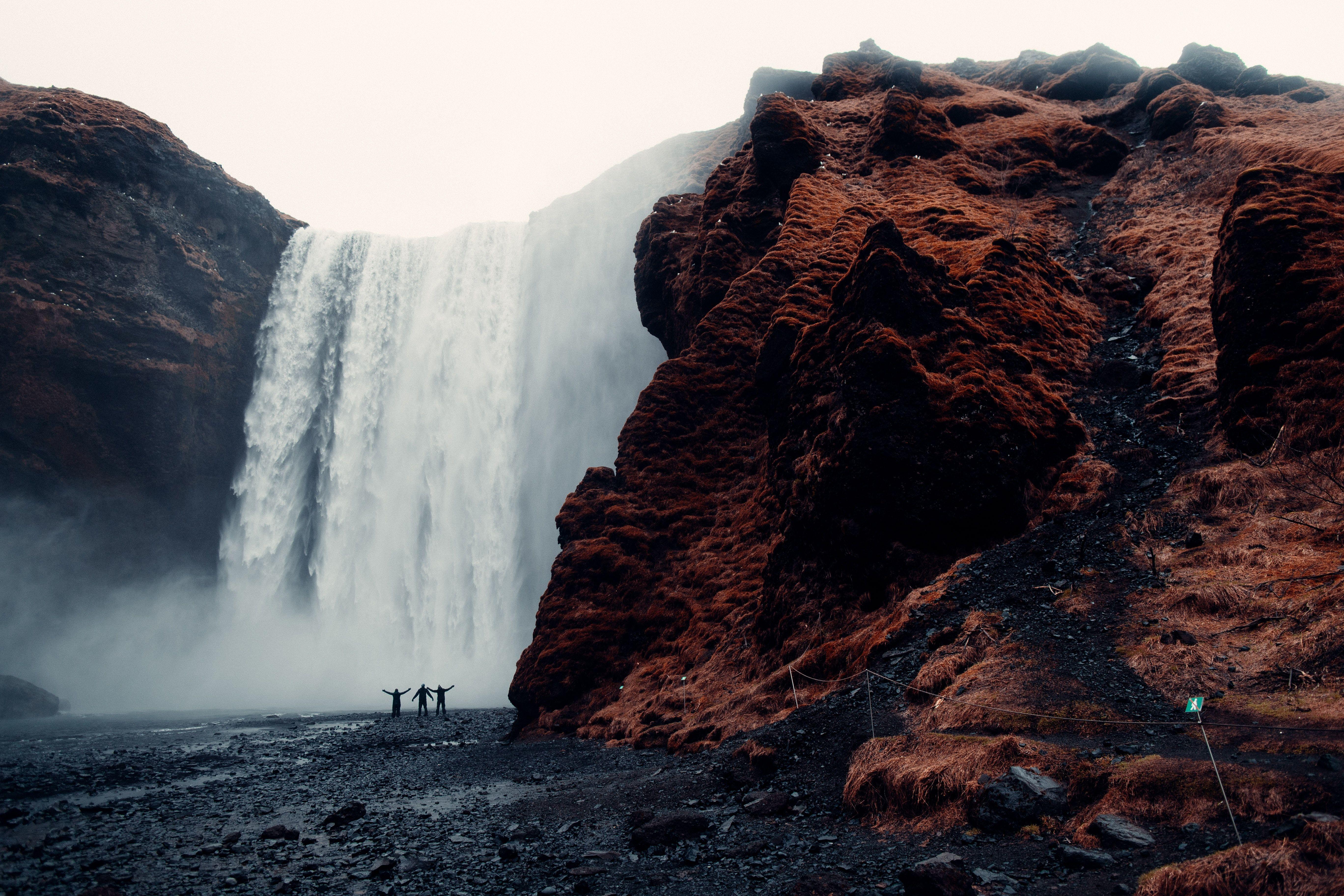5472x3648 Three Men Standing Near Waterfalls · Free
