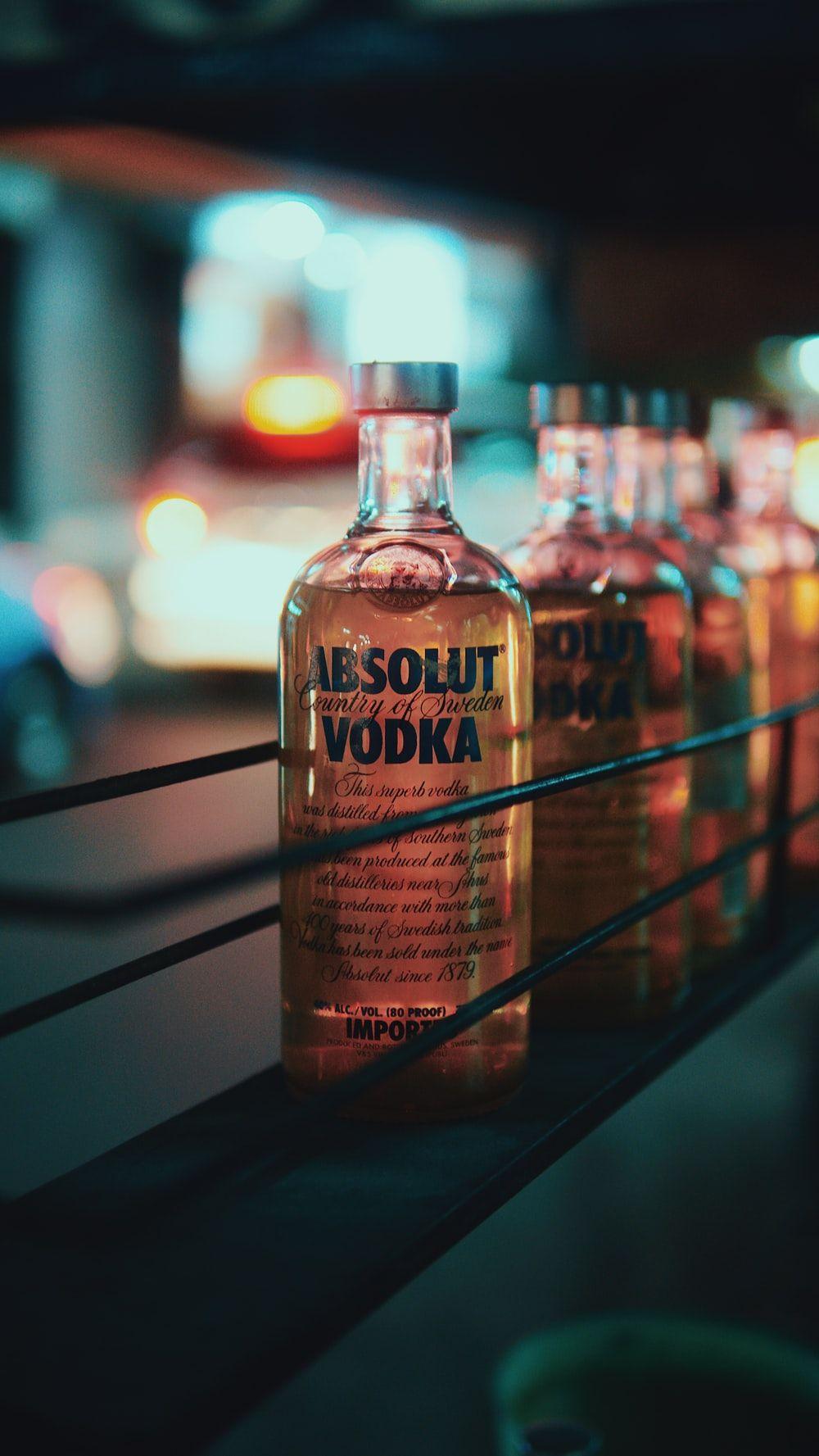 1000x1777 Smirnoff vodka bottle besides shot glass photo