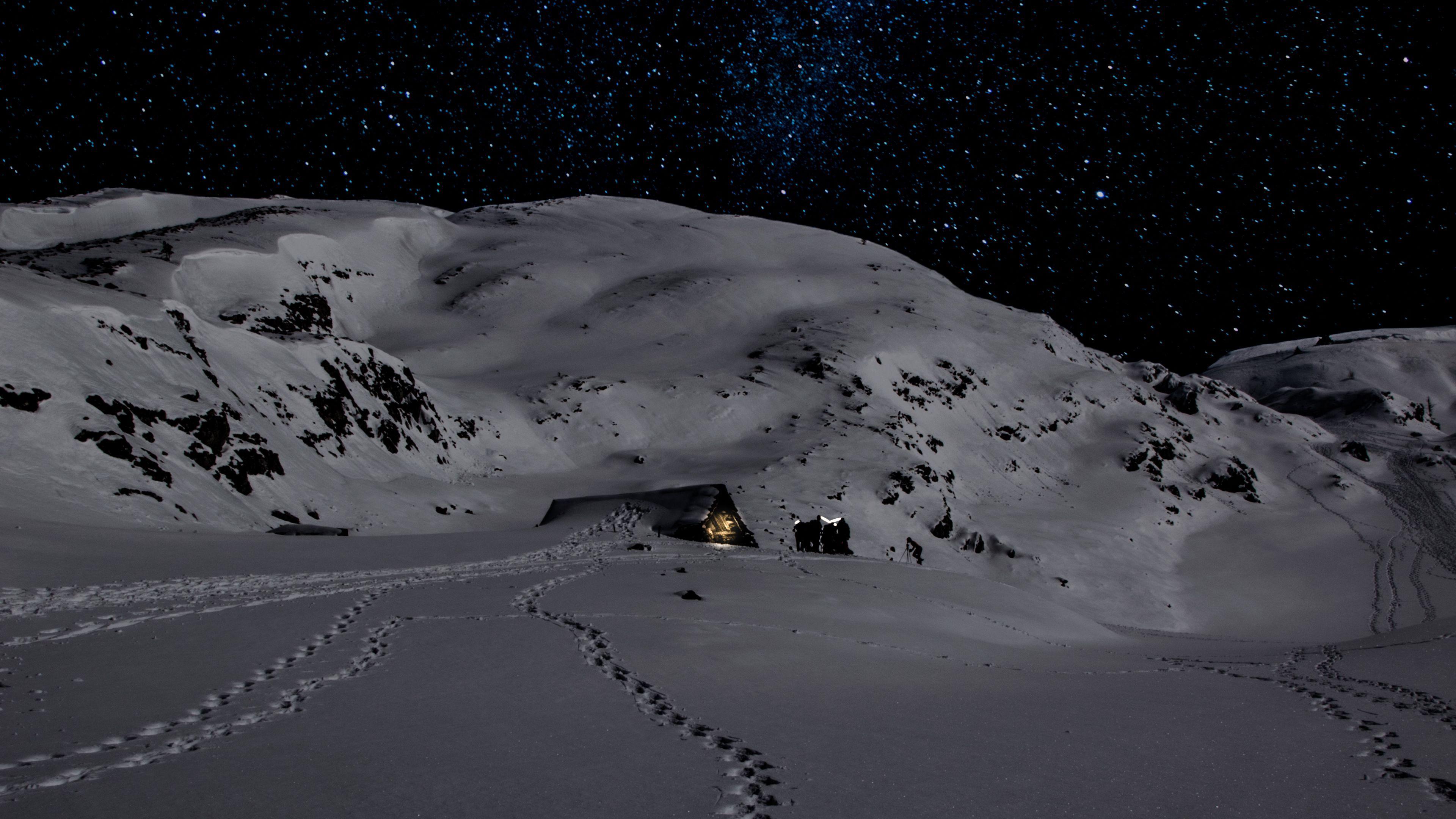 3840x2160 Download wallpaper 3840x2160 night, snow, mountains, footprints, winter 4k uhd 16:9 HD background