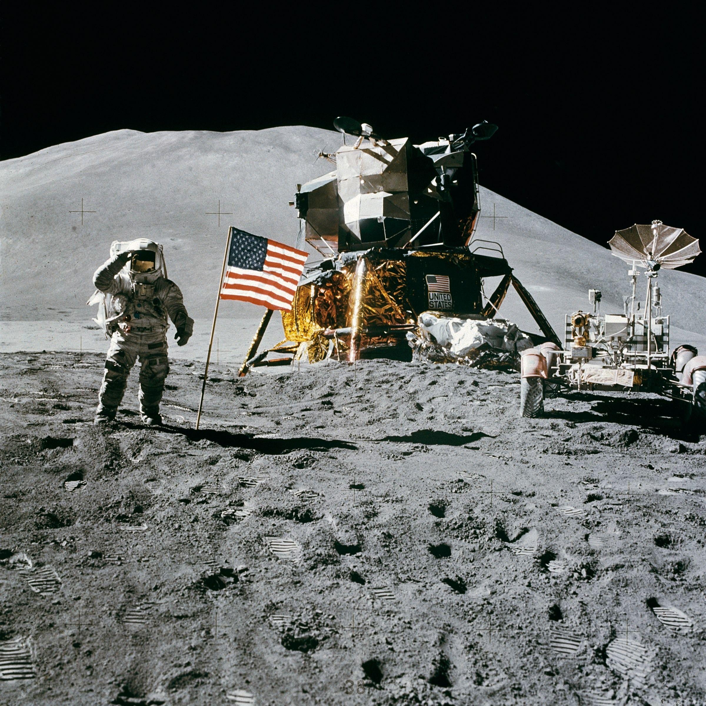 2400x2400 Astronaut Standing Beside American Flag on the Moon · Free