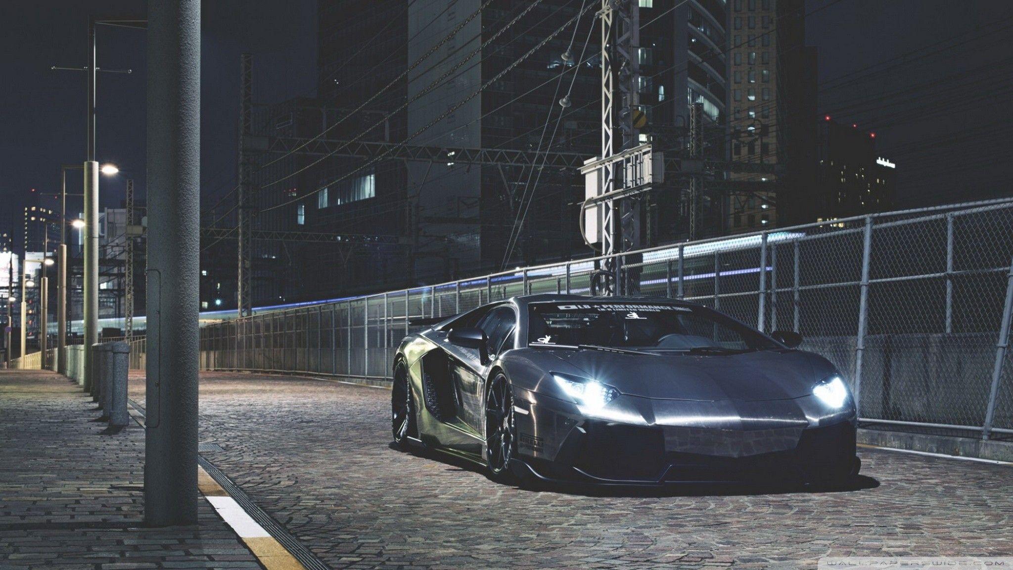 2048x1152 #Lamborghini, #night, #gray, #Lamborghini Aventador, #road, #lights, #city, wallpaper. Mocah.org HD Wallpaper