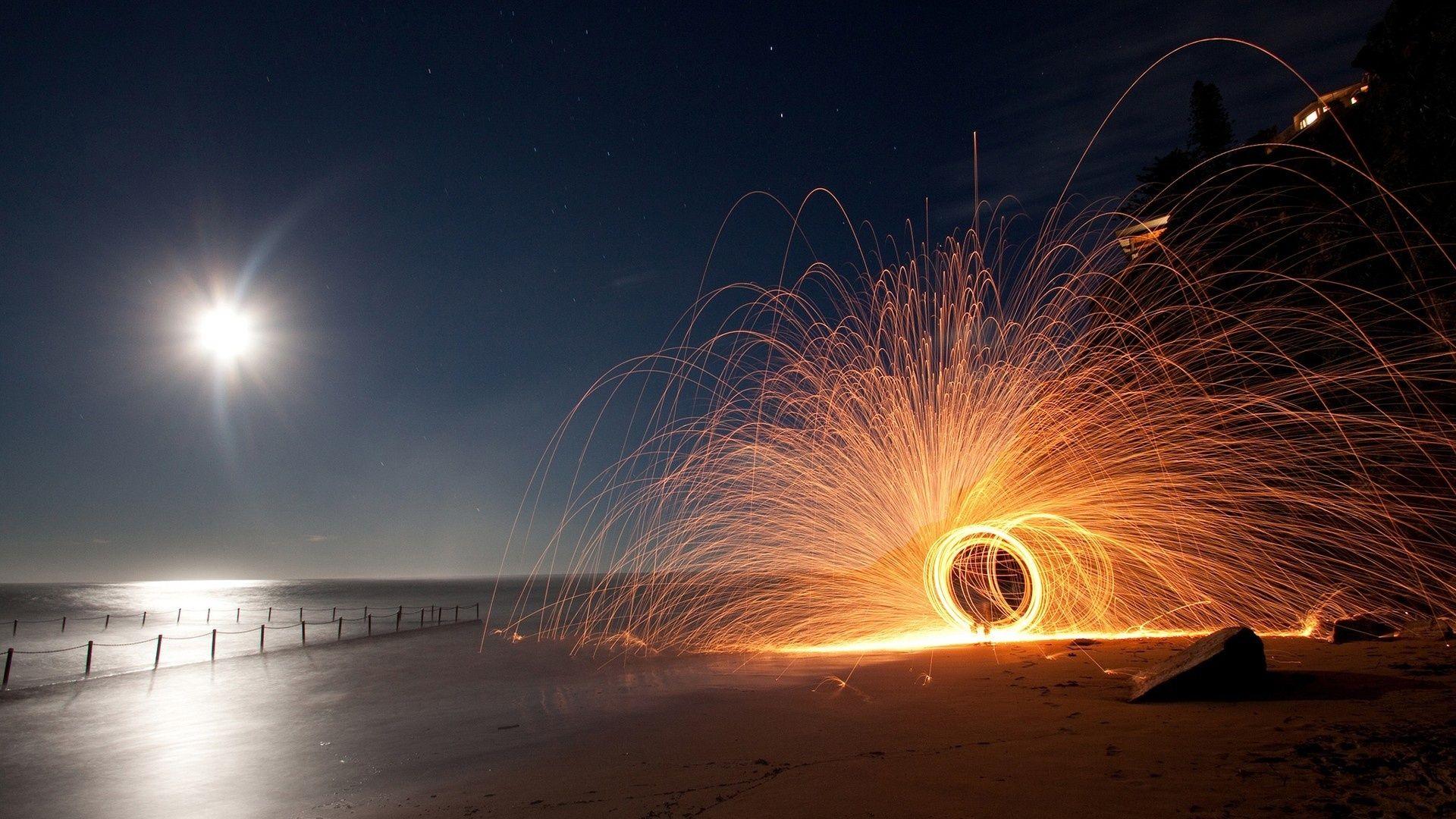 1920x1080 Circular Sparkler On A Beach At Night HD Desktop Background