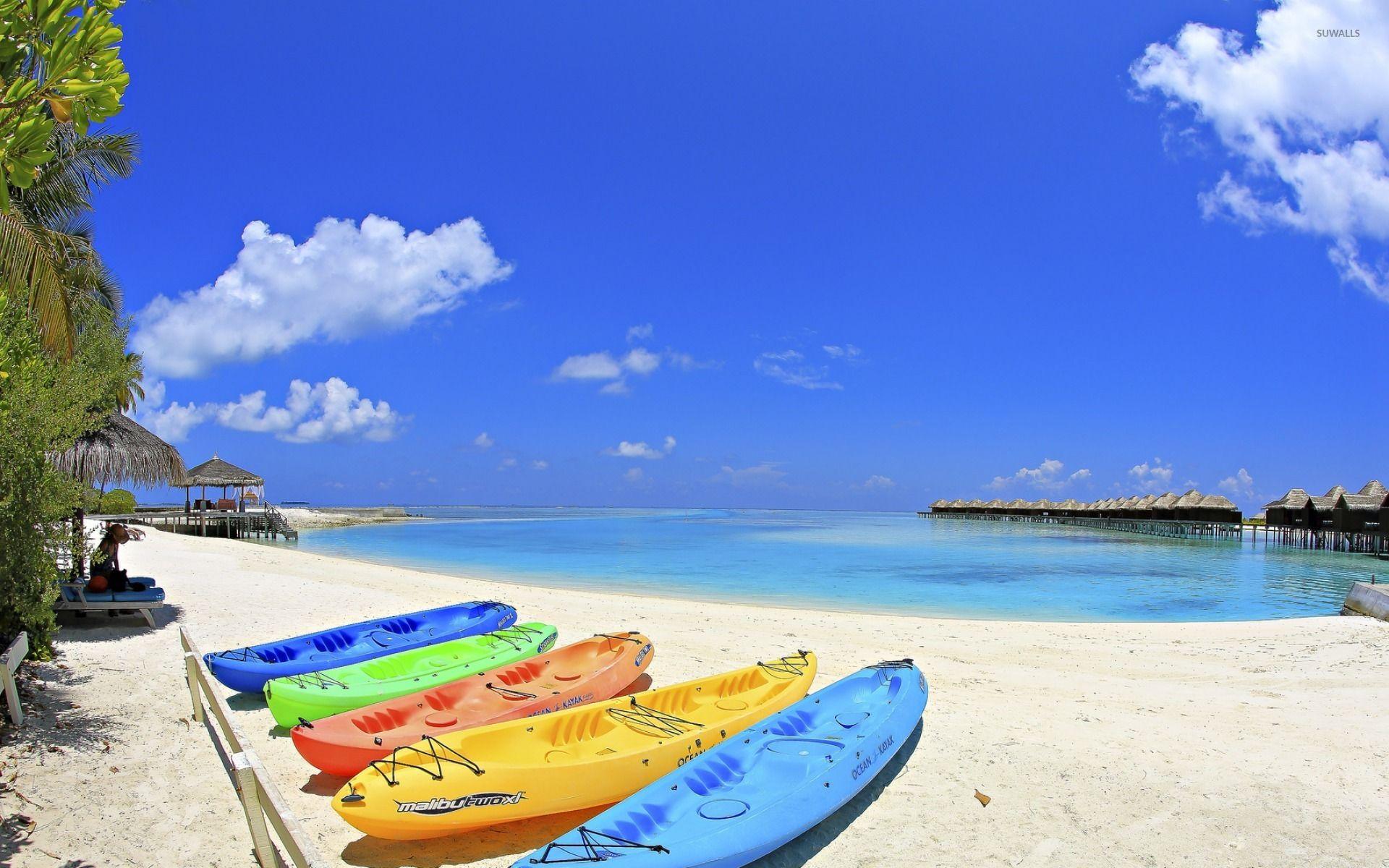 1920x1200 Kayaks on a tropical beach wallpaper wallpaper