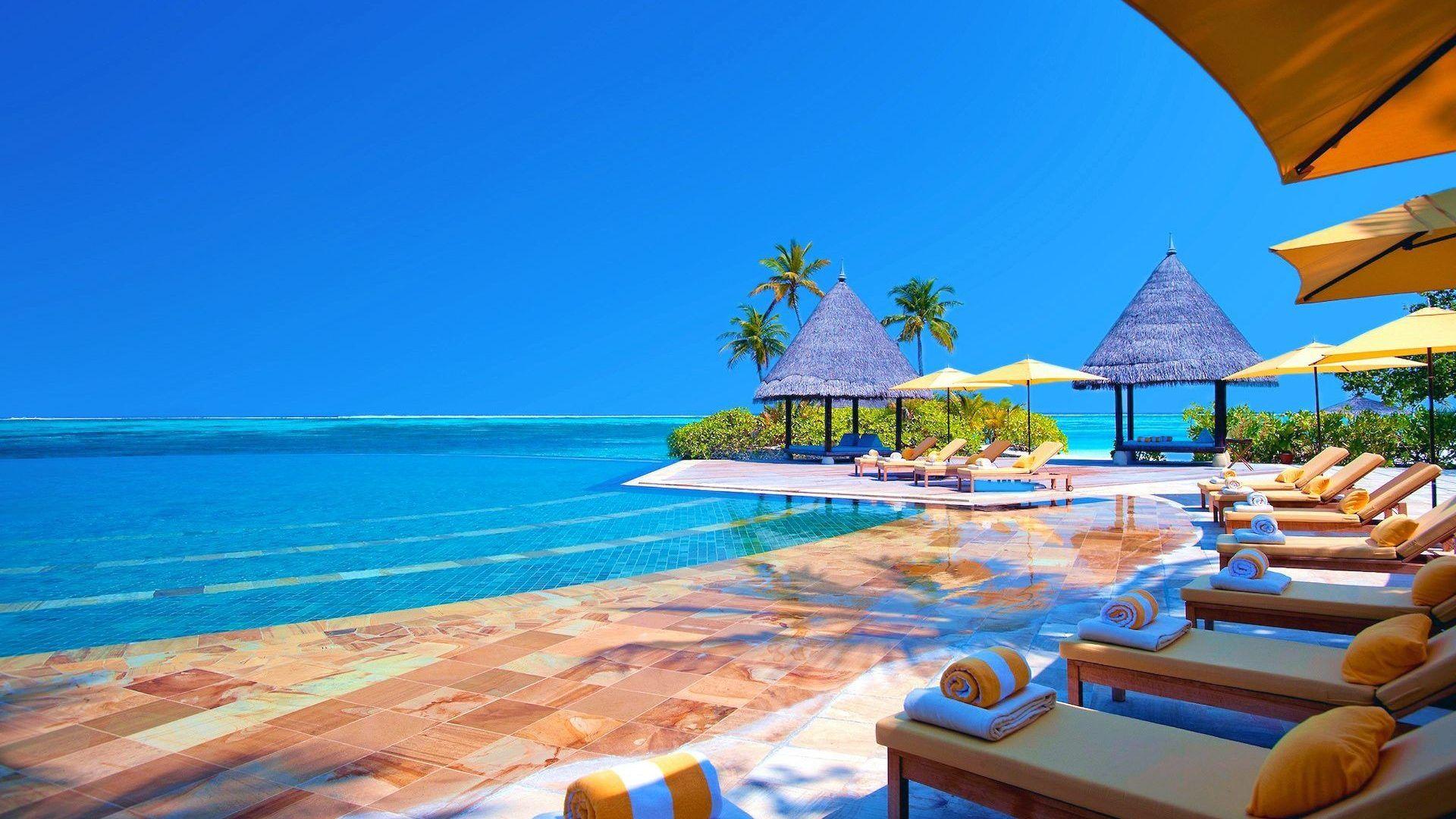 1920x1080 Tropical Gazebo Beach Beachchairs Water Sea Palms Desktop Background For Mac