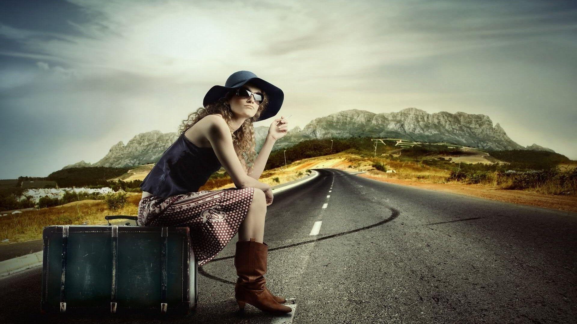 1920x1080 HD Girl sitting on the suitcare on the road Wallpaper