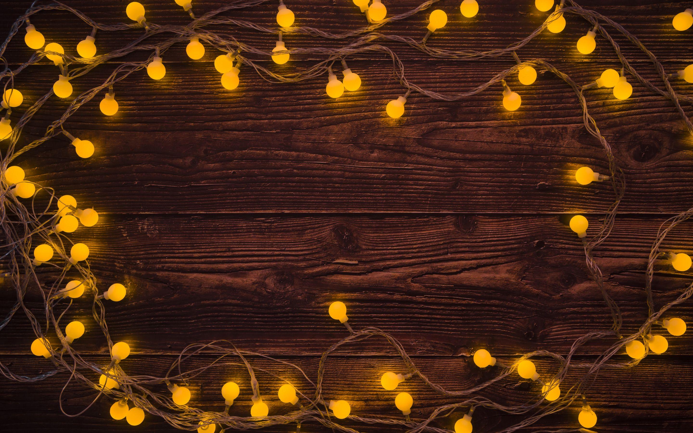 2880x1800 Download wallpaper wooden background, brown boards, garland, light bulbs, evening, Christmas, New Year for desktop with resolution 2880x1800. High Quality HD picture wallpaper