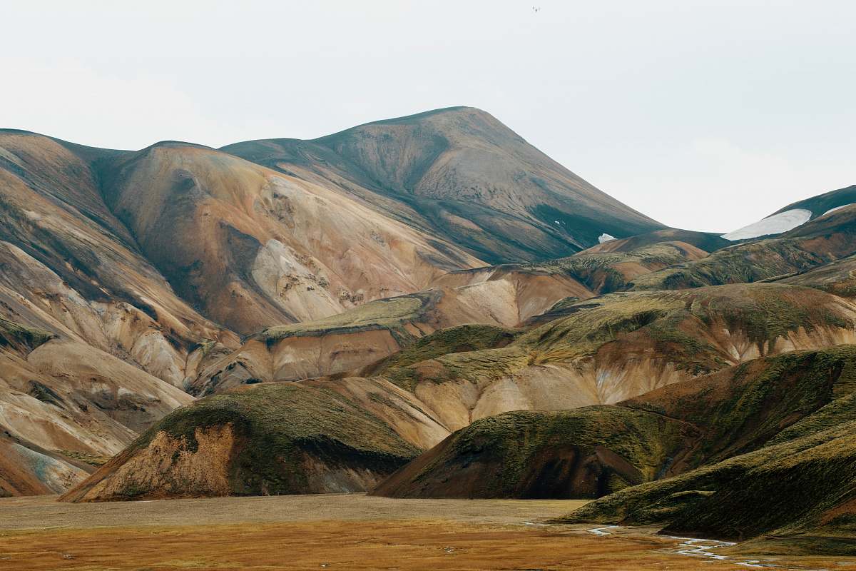 1200x800 desktop wallpaper green and brown mountain under white sky photo during daytime desktop background Image