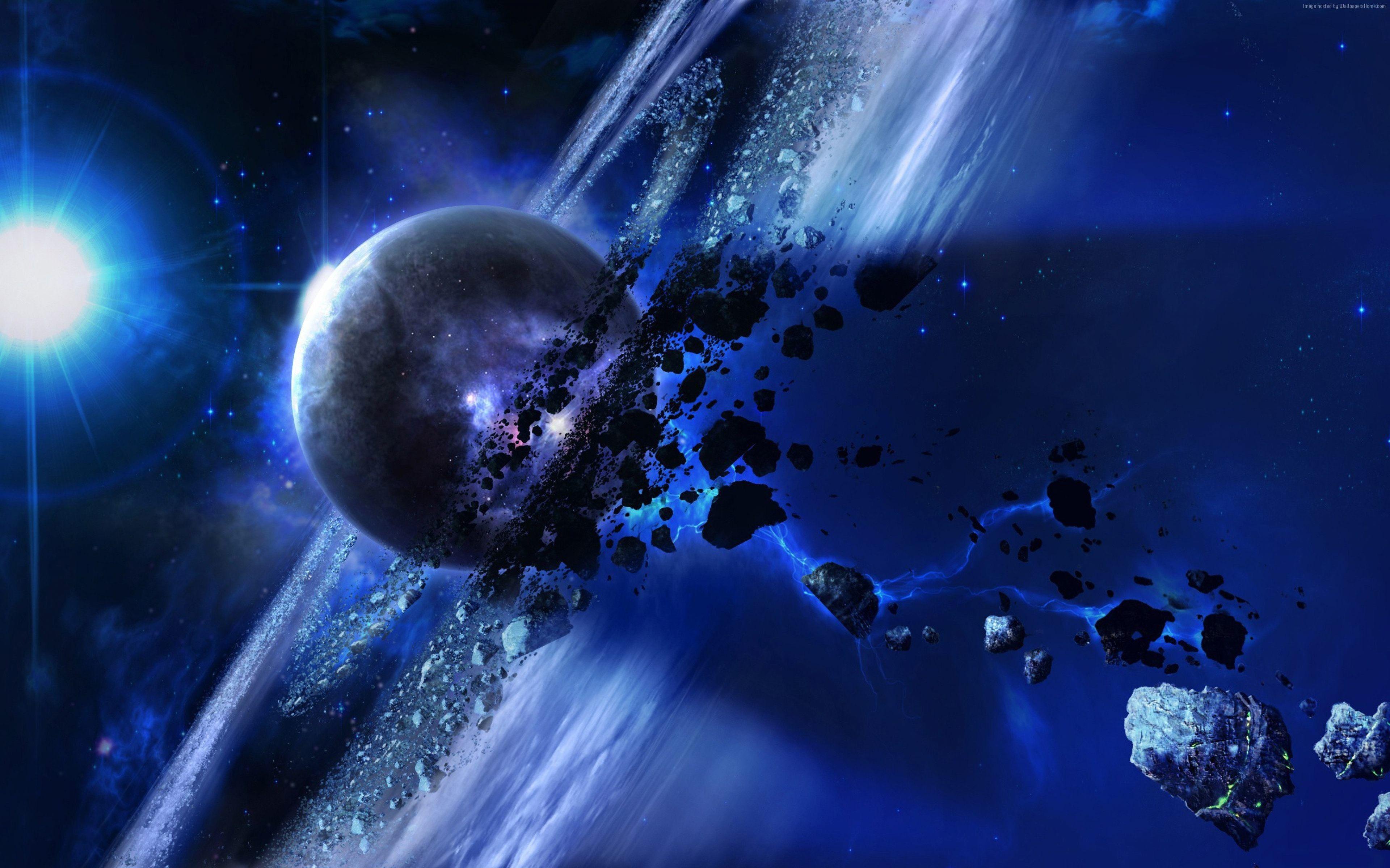 3840x2400 The flight of meteorites around the planet Saturn in space wallpaper and image, picture, photo