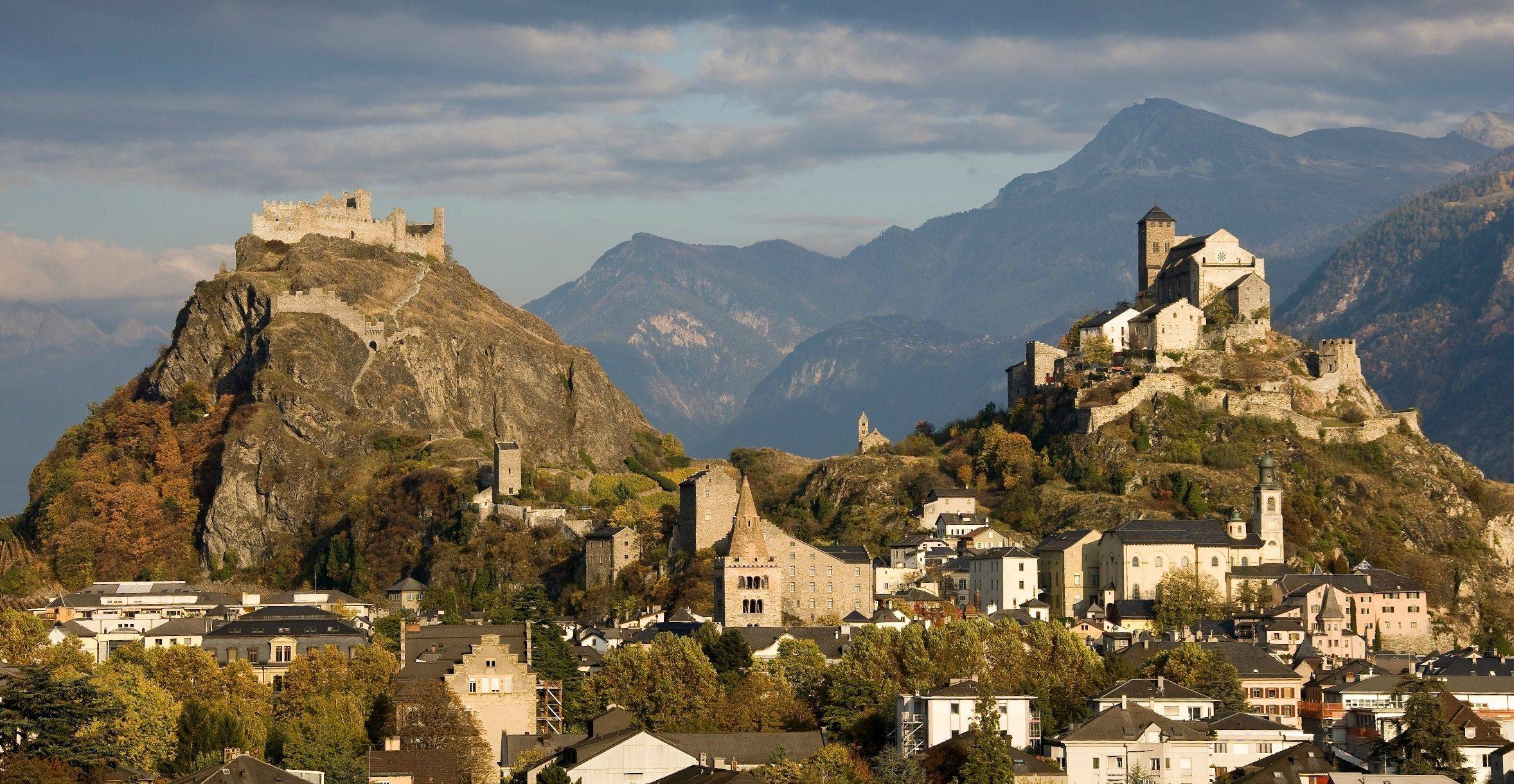 2356x1220 Tourbillon & Valère, Switzerland. These are two adjacent castles in the Swiss town of Sion. Tourbillon castle is on the hill to the left and the fortified basilica of Valere is on