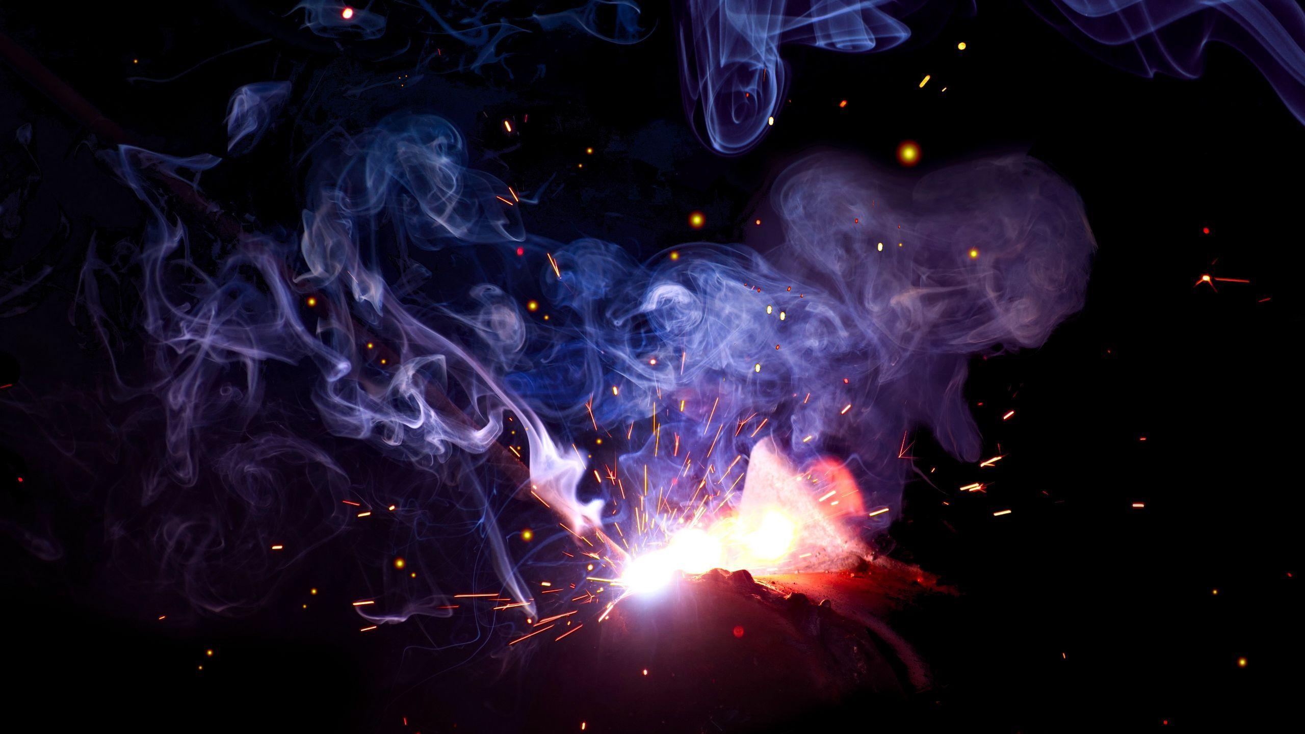 2560x1440 Download wallpaper 2560x1440 smoke, sparks, colored smoke, dark widescreen 16:9 HD background