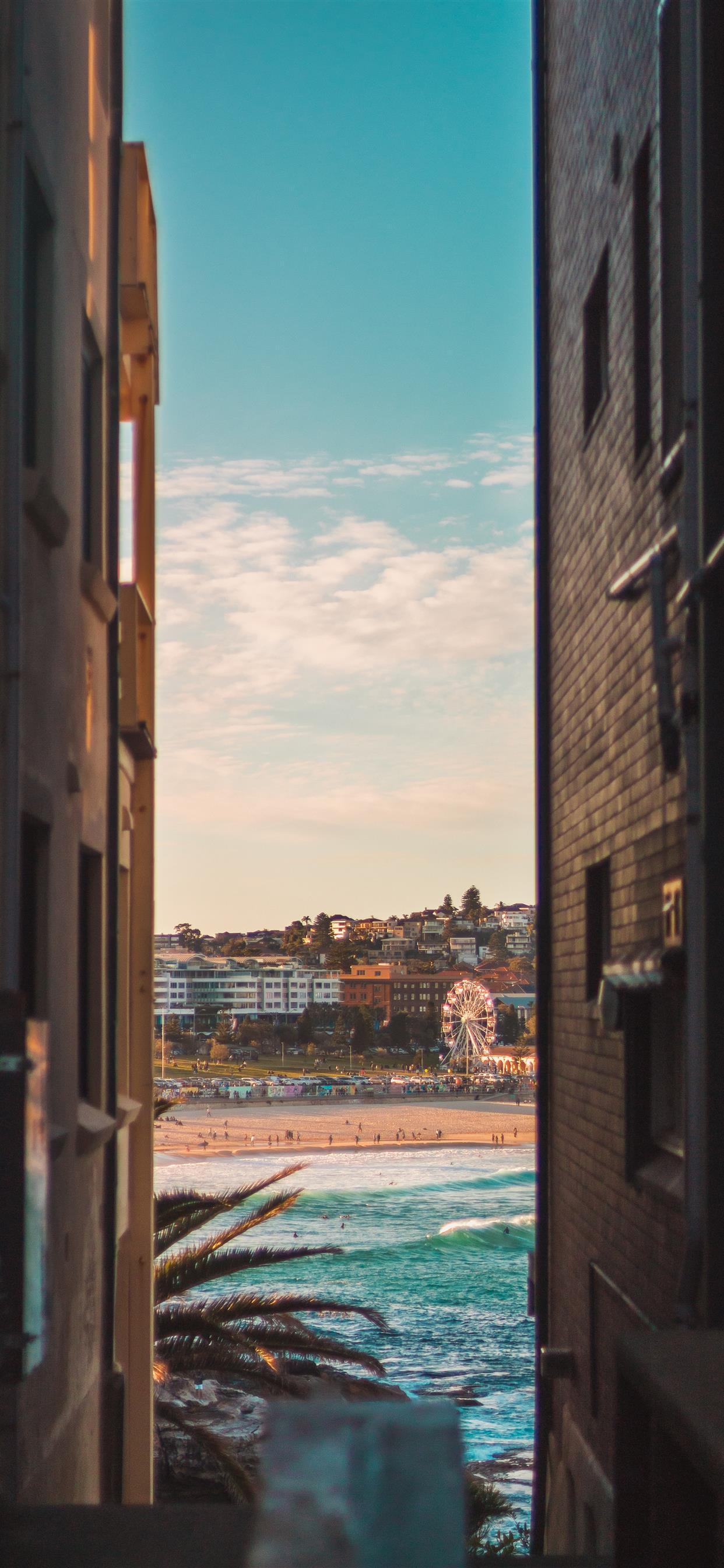 1242x2688 Bondi beach between two houses iPhone Wallpaper Free Download