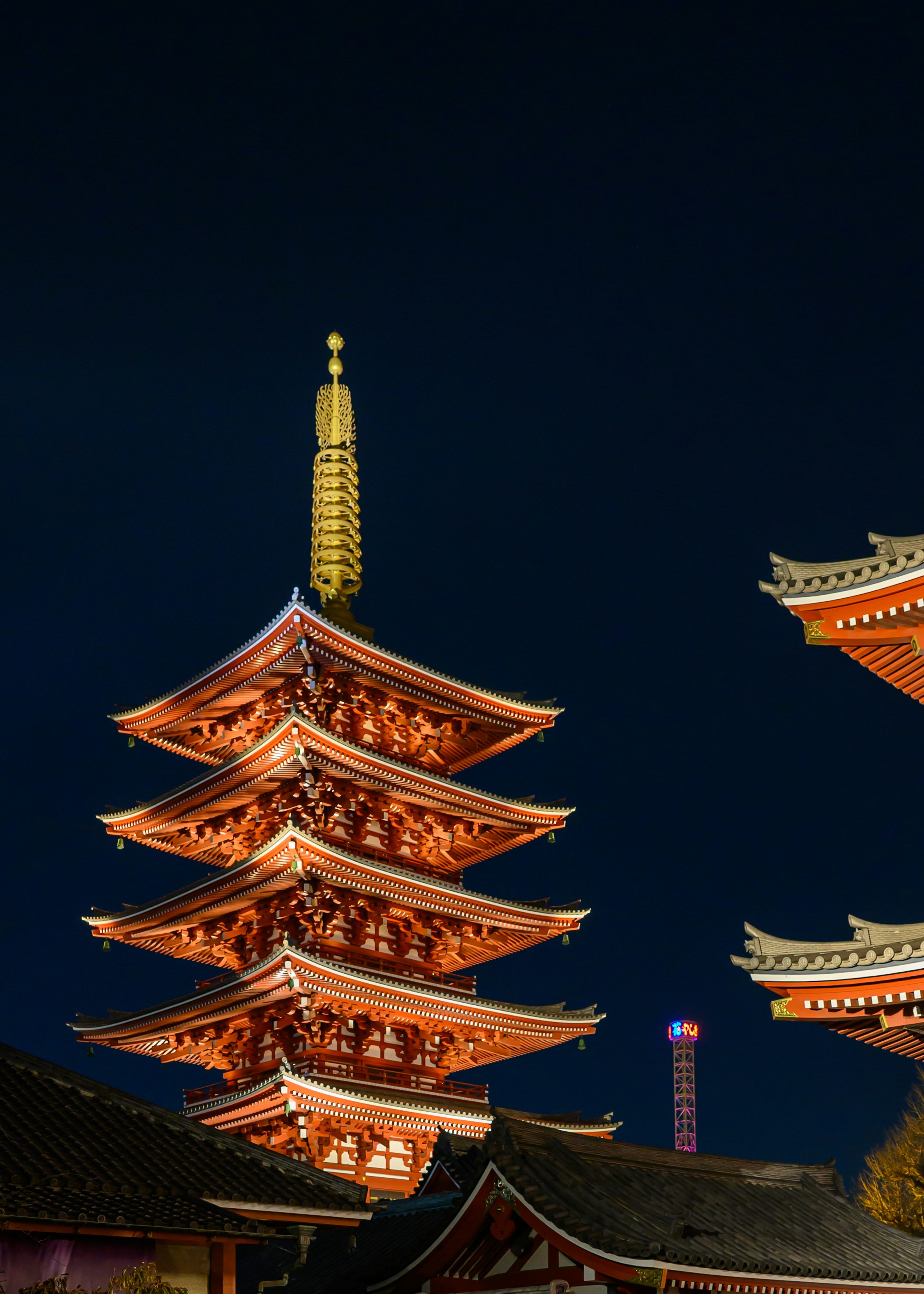 3000x4200 Japanese temple lit up at night. photo