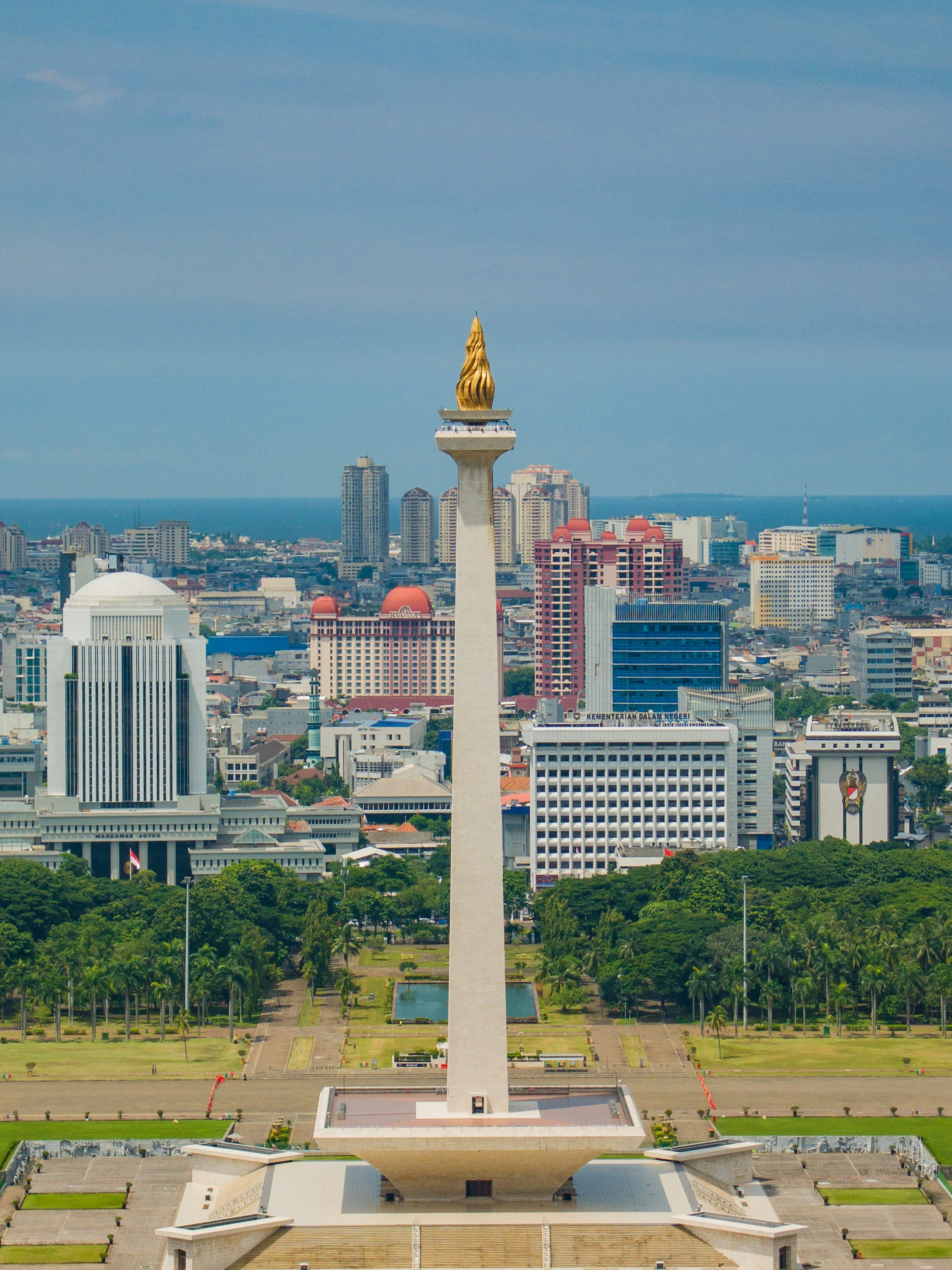 3000x4000 A tall tower in a city photo