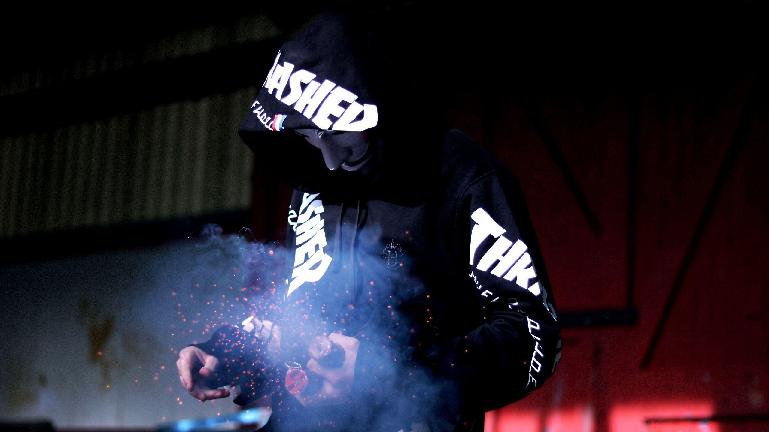 2560x1440 Download wallpaper: Smoke, anonymous mask, sparklers 2560x1440