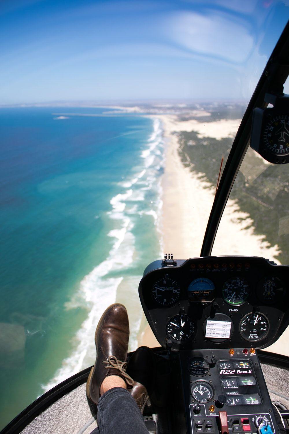 1000x1500 person inside aircraft over beach photo