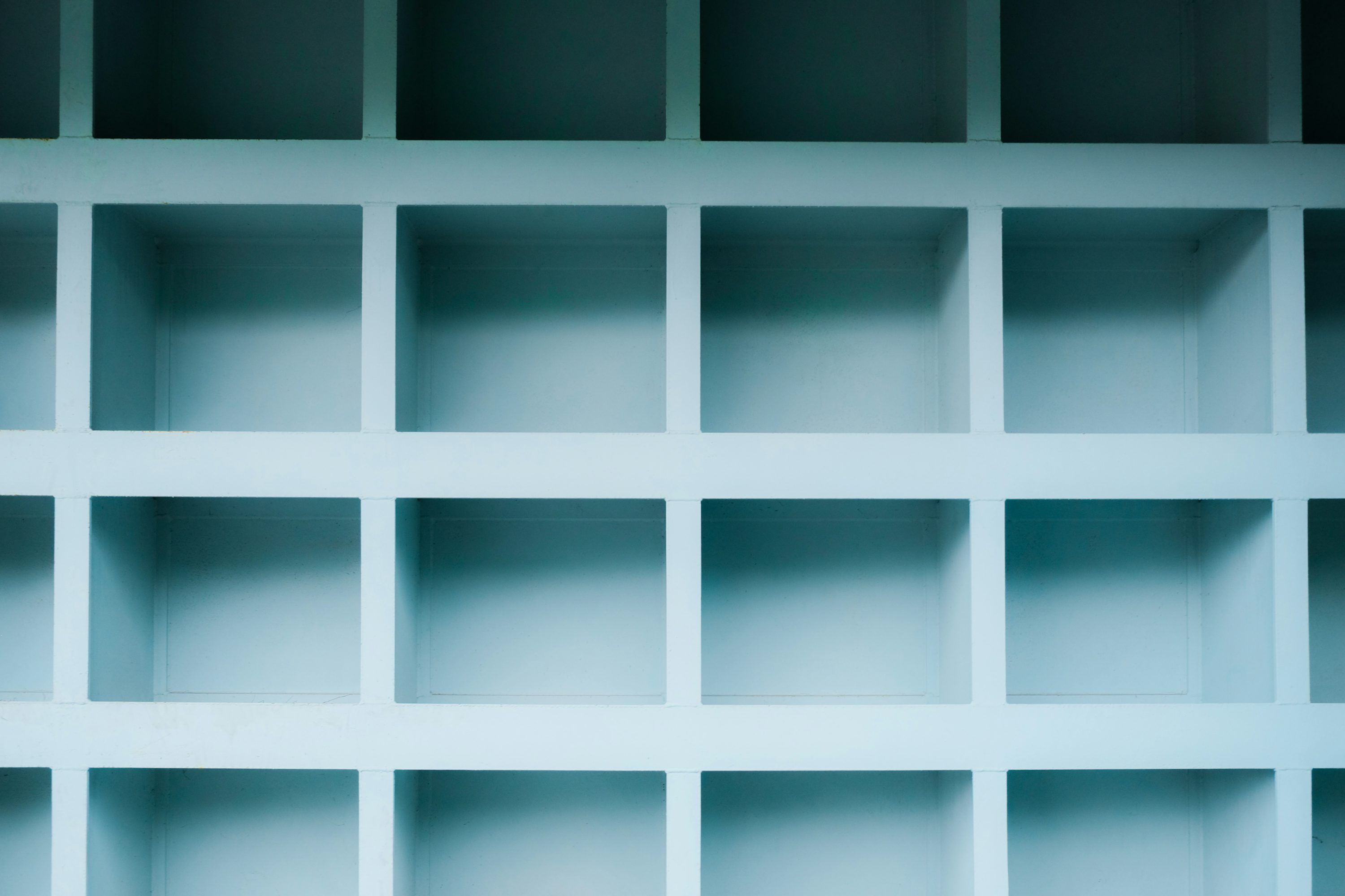 3000x2000 A white shelf filled with lots of empty shelves photo