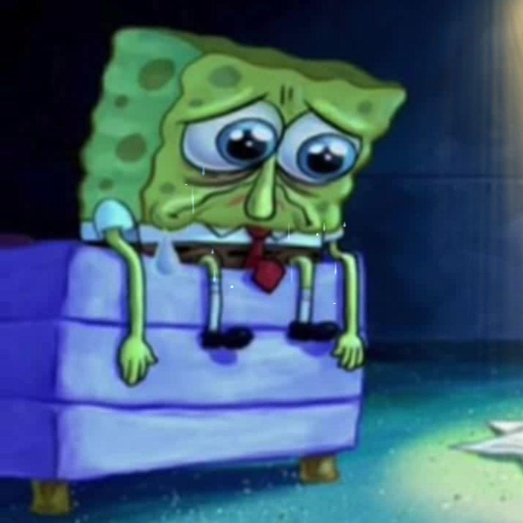 Download Spongebob Crying And Sad Looking At Cup Wallpaper