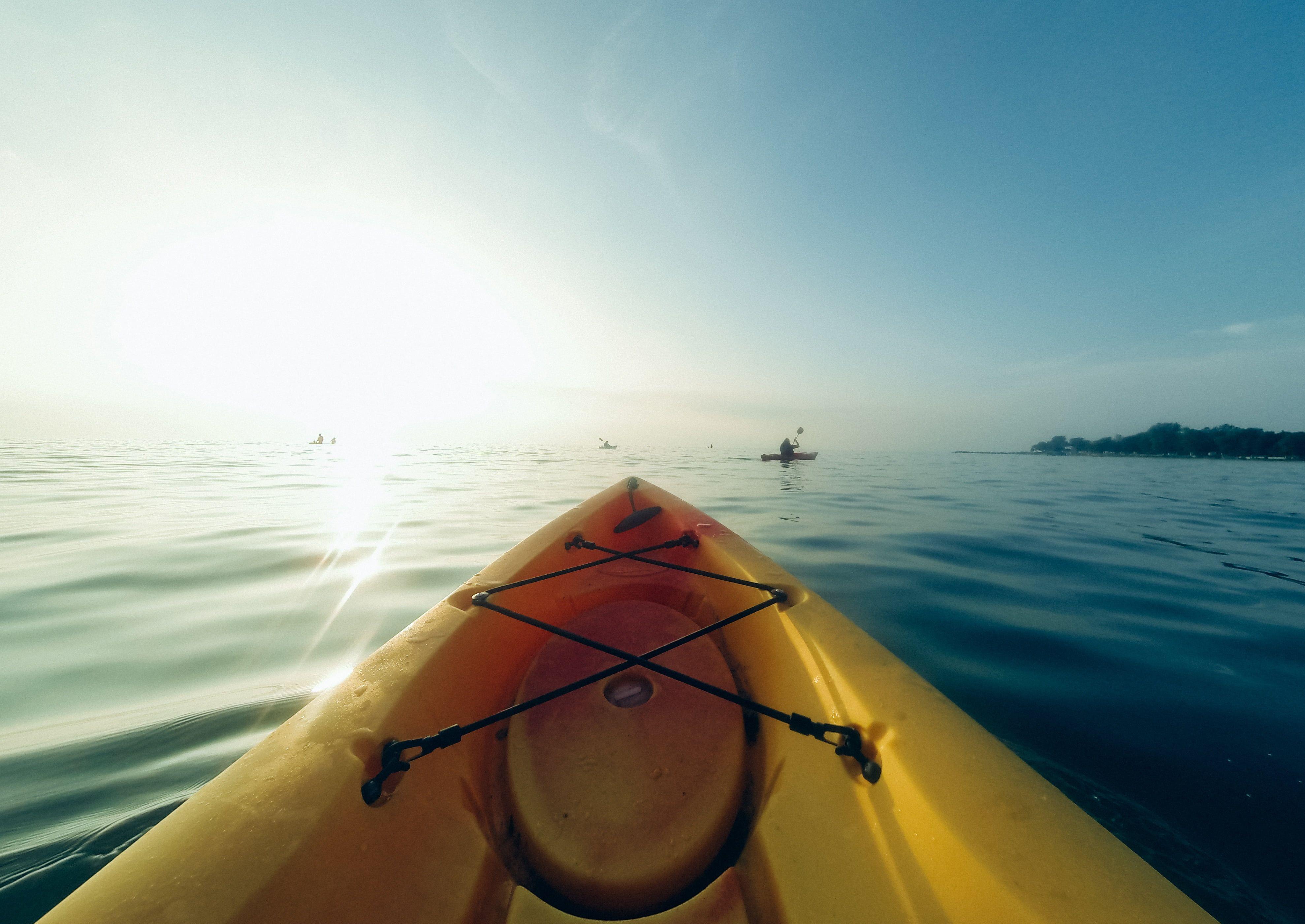 3956x2801 Photography of yellow kayak on clear body of water HD wallpaper