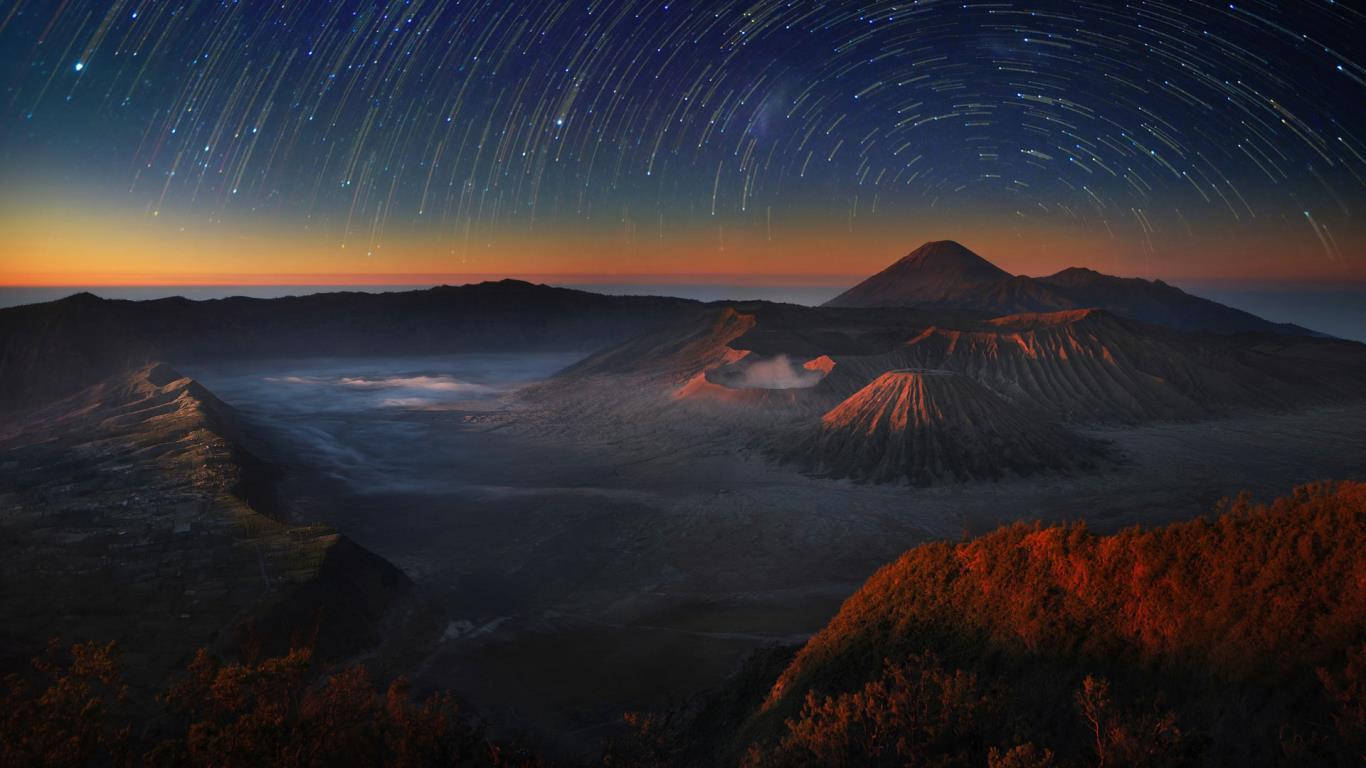 1366x768 Time Lapse Exposure Of The Night Sky Above Bromo Tengger Semeru National Park In East Java, Indonesia