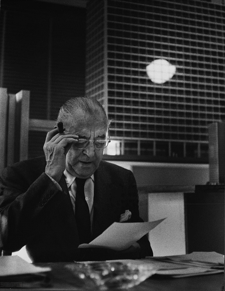 791x1024 The Architect Mies Van Der Rohe Wearing Glasses Sitting Looking At A Paper With Model Of New Ibm Building In Background Chicago Il Ca 1960s Photo By Hedrich Blessing. The Charnel House