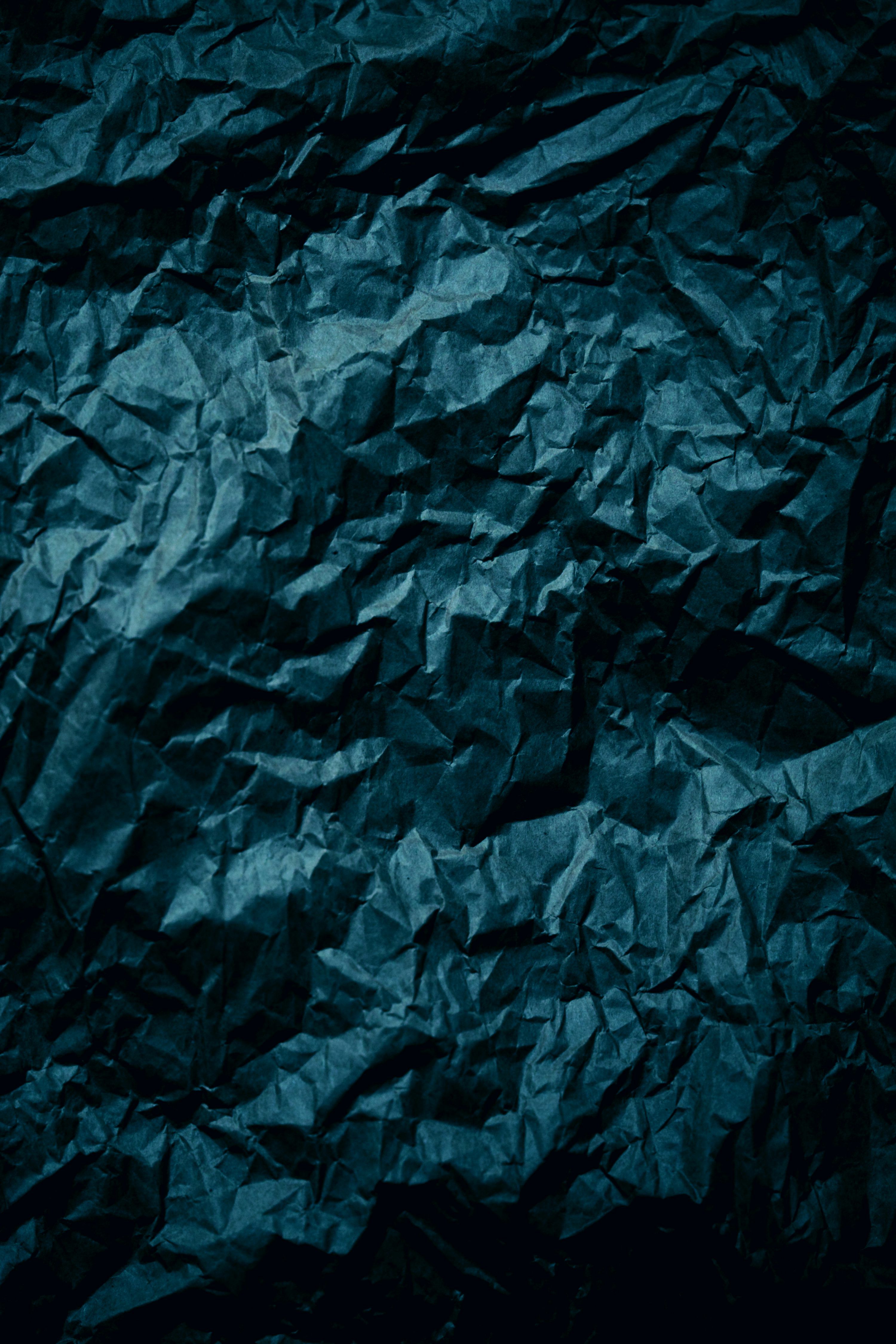 3000x4500 A dark blue crumpled paper background photo