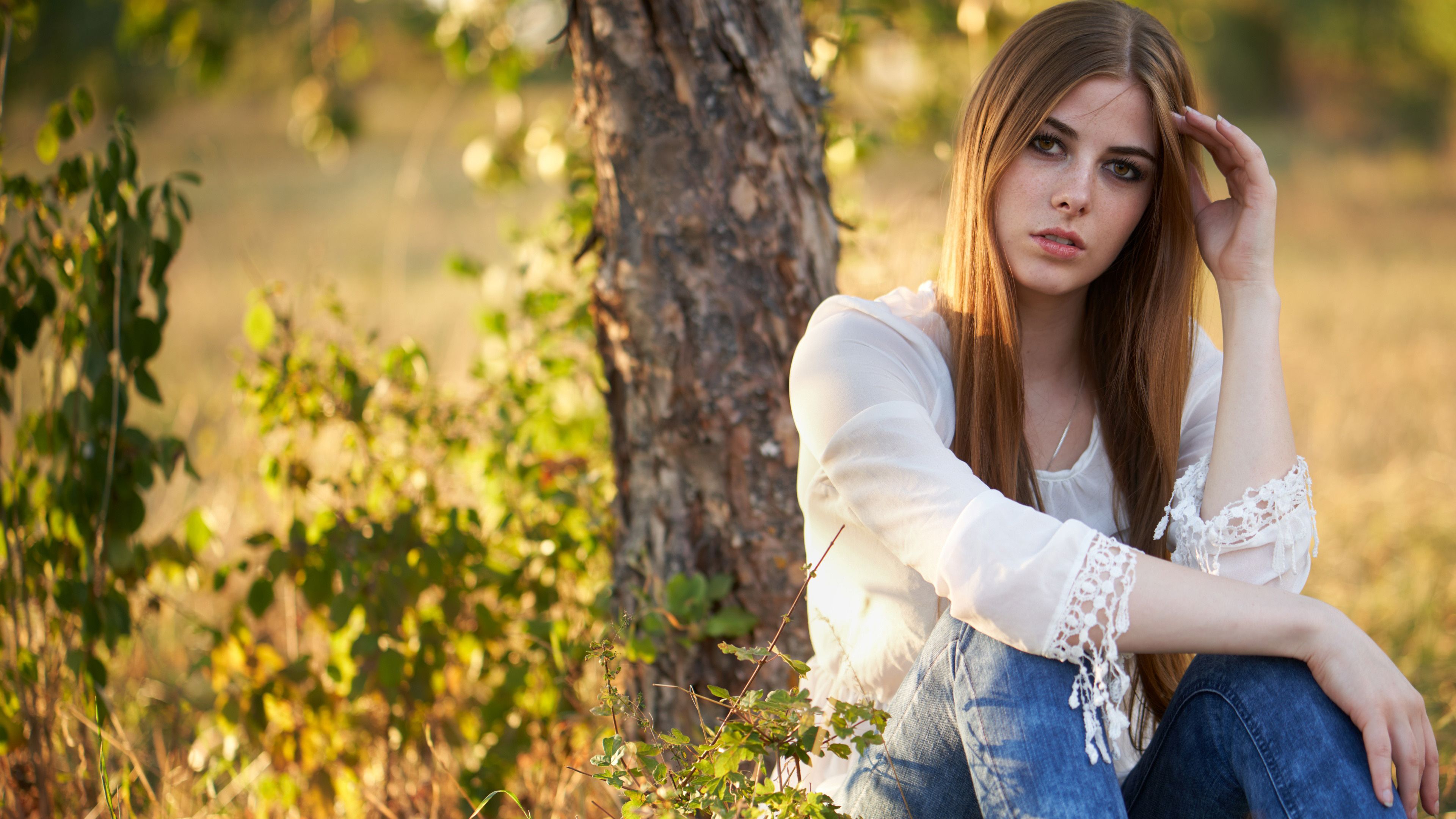3840x2160 Beautiful Girl Model Is Sitting In Front Of Tree Wearing White Blue Dress 4K HD Girls Wallpaper