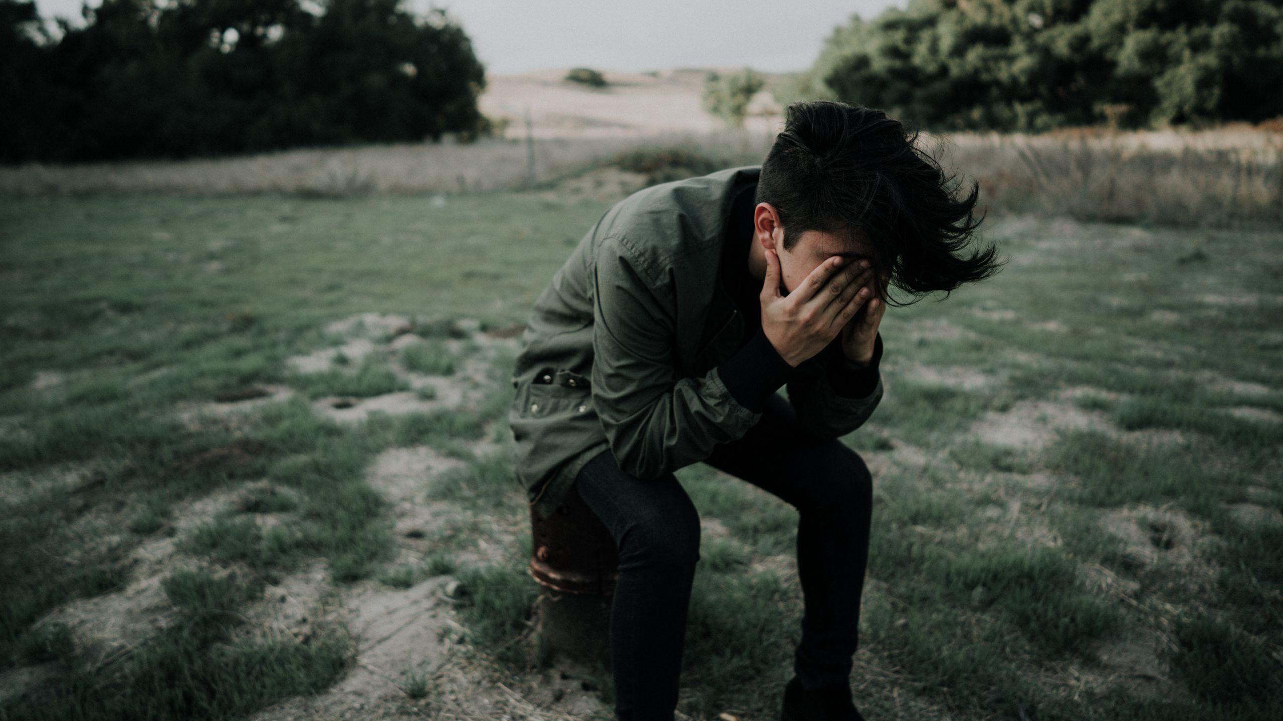 2560x1440 Download wallpaper 2560x1440 man, hands, face, sad widescreen 16:9 HD background