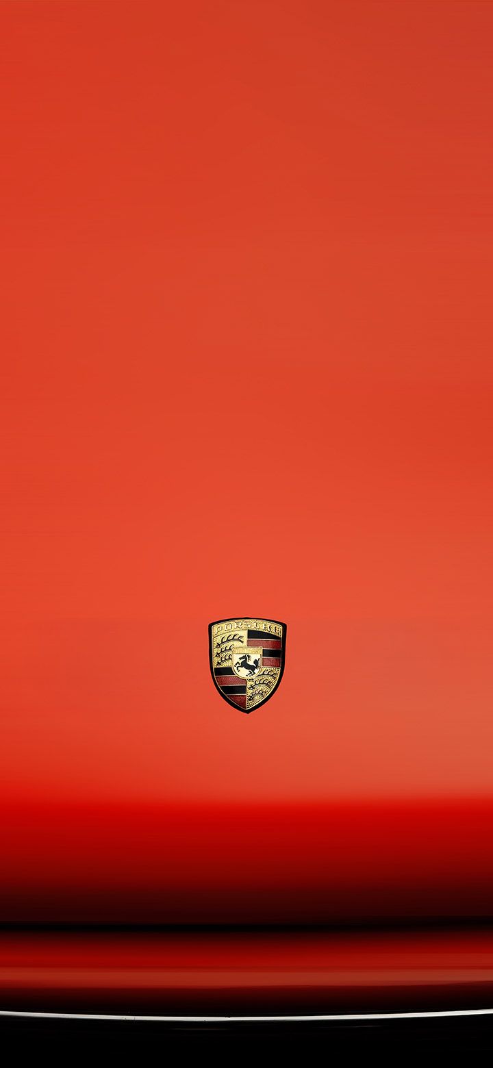 720x1560 Porsche emblem on a red hood 4K phone Wallpaper