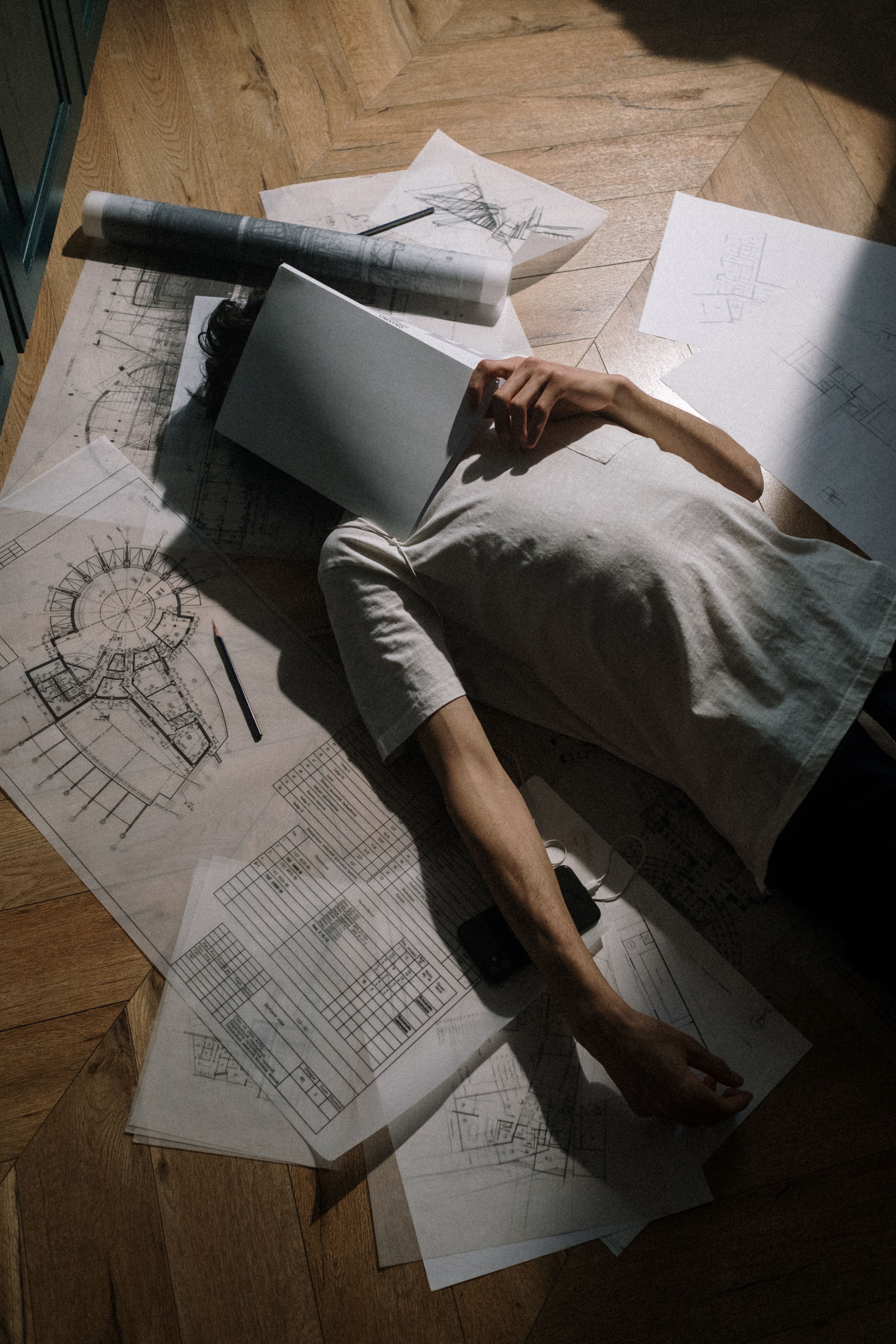 4160x6240 Adult man laying down on floor with book on head · Free
