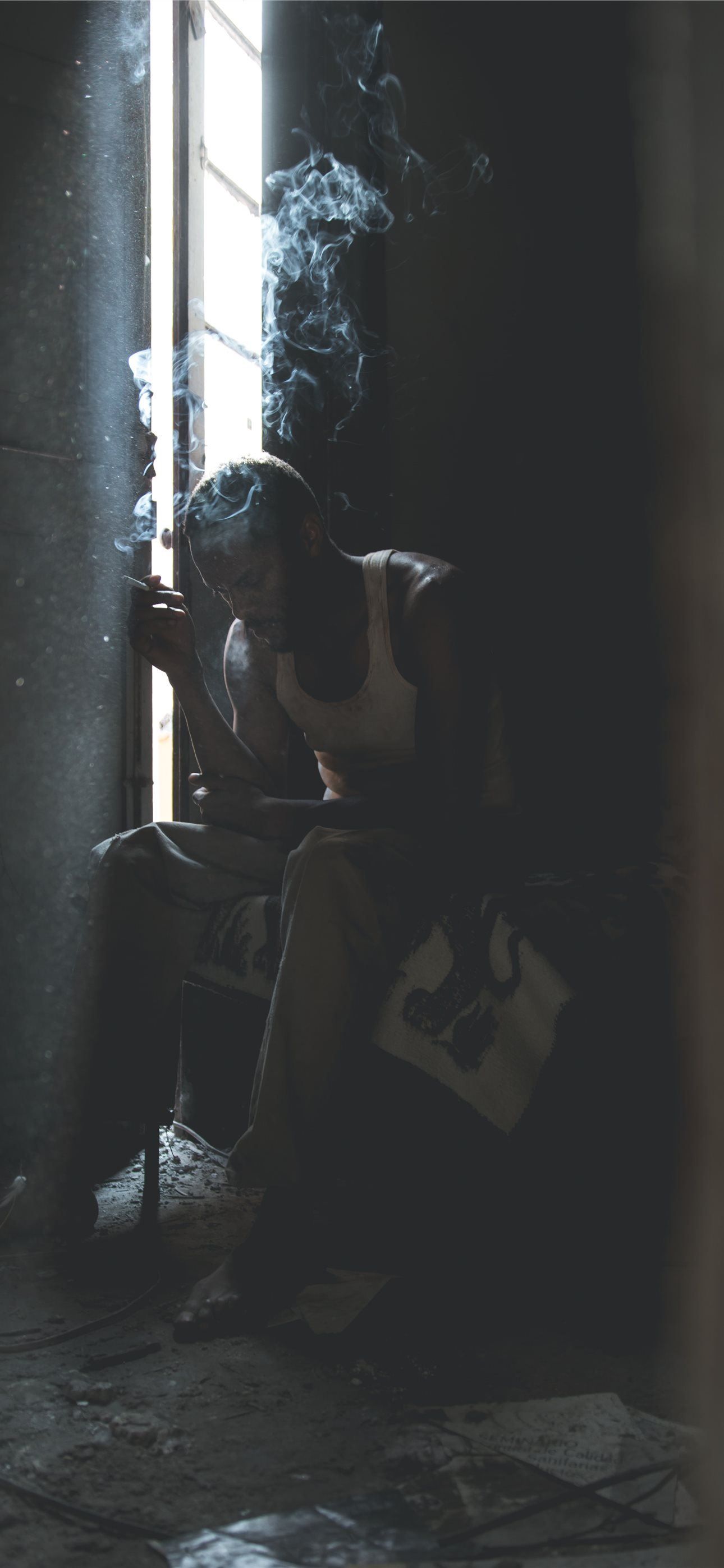 1290x2796 man smoking sitting on chair iPhone Wallpaper Free Download