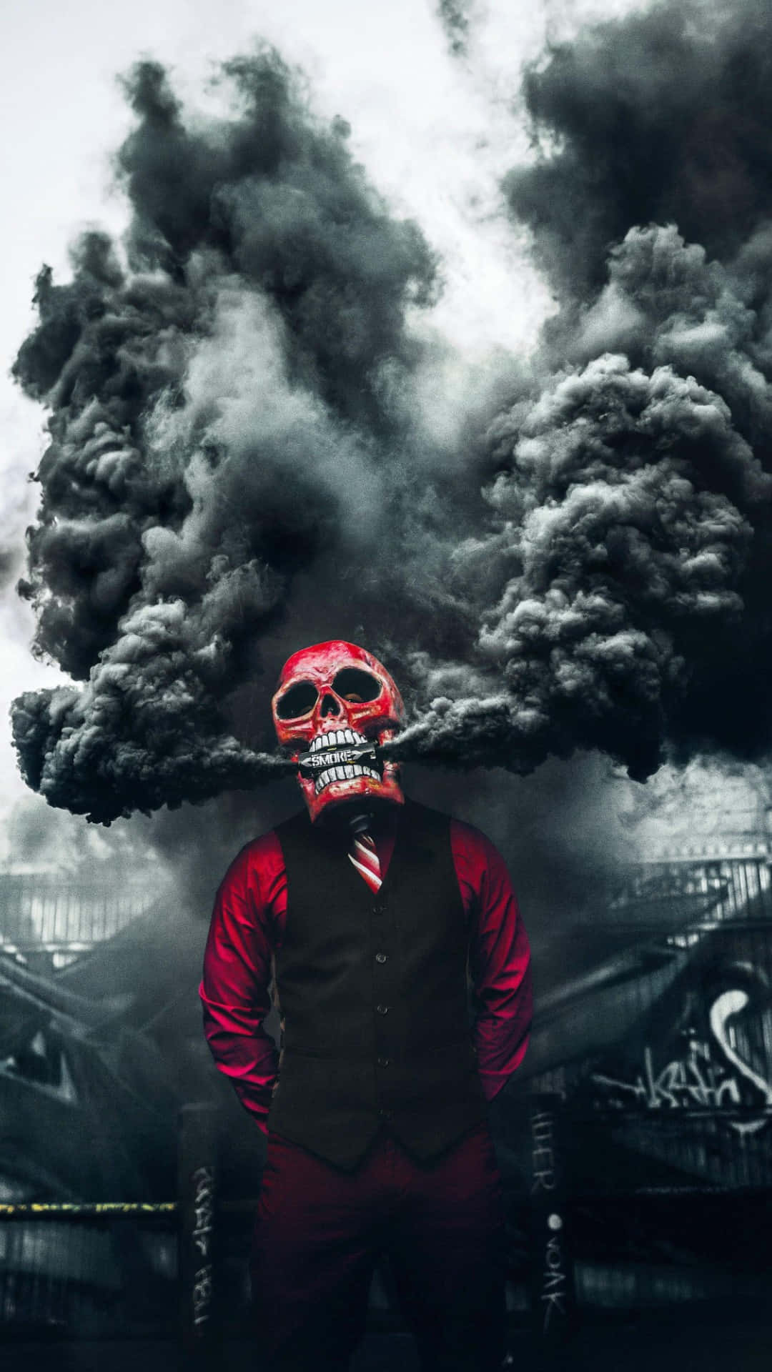 1080x1920 A Man In A Red Suit Standing In Front Of A Black Smoke Wallpaper