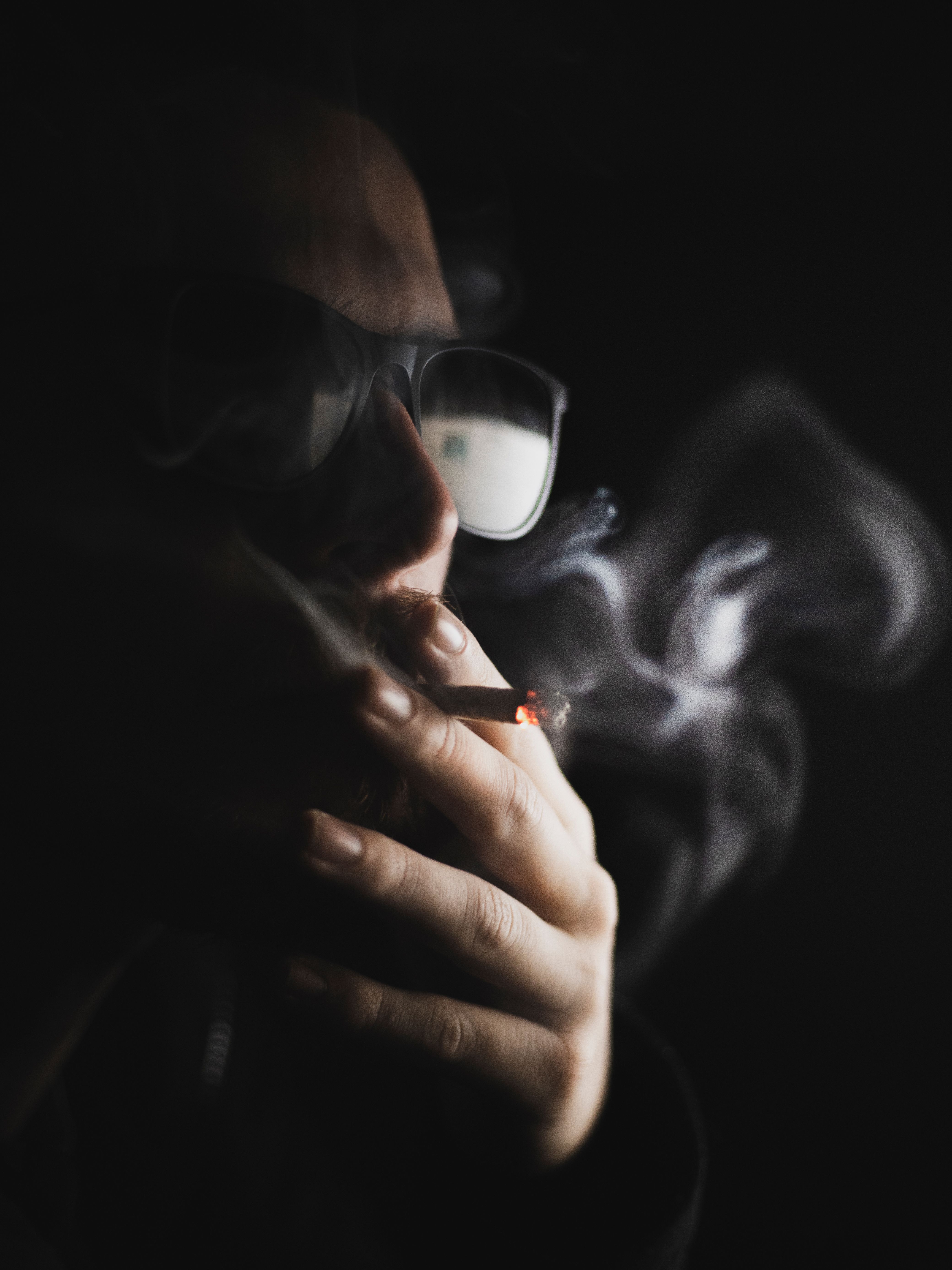 4160x5546 A Person Smoking in the Dark · Free