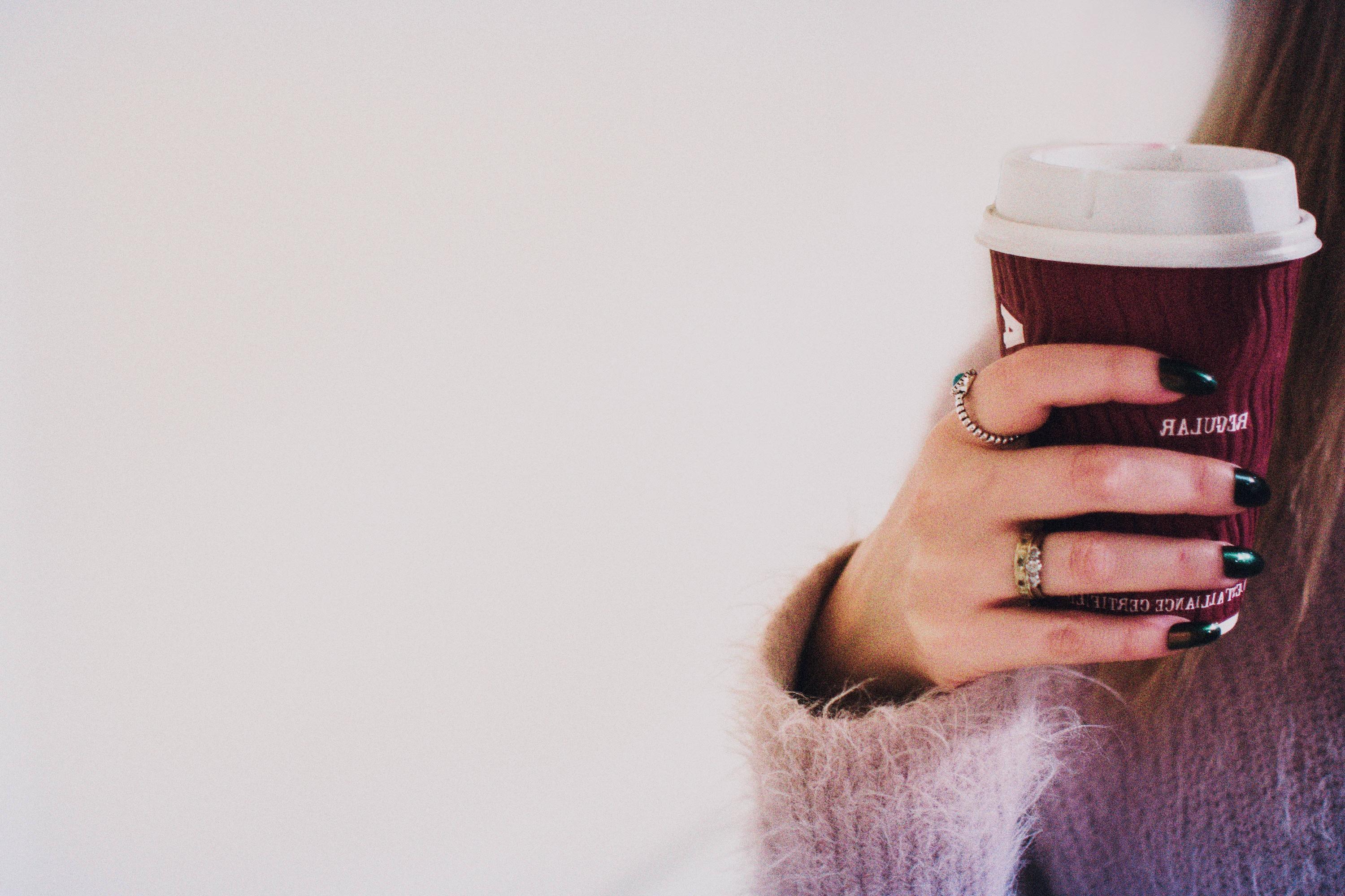 6000x4000 Person With Black Manicured Nails Holding Brown Cup With White Lid Wallpaper