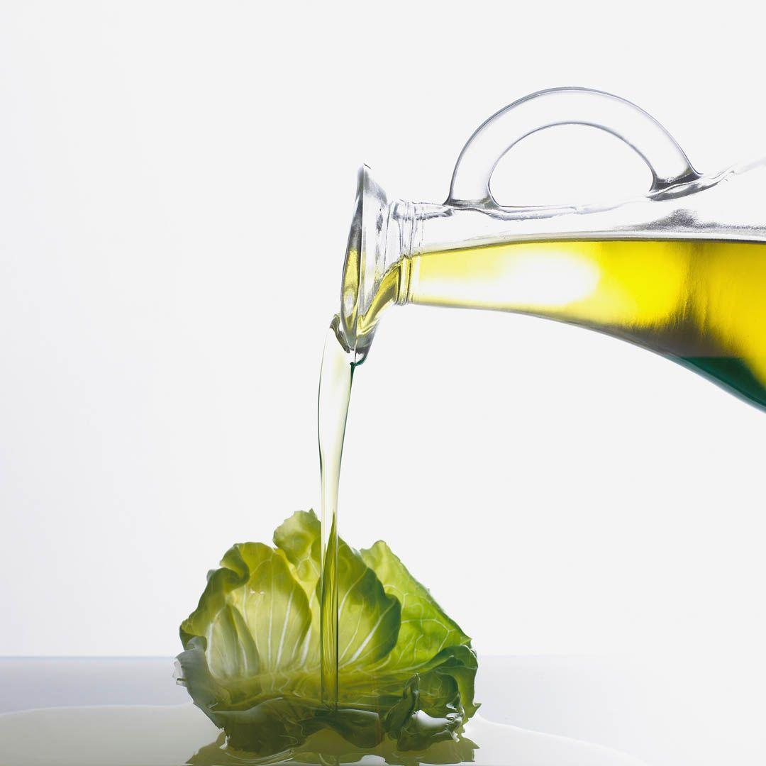 1080x1080 Olive Oil Pouring On Lettuce Leaf