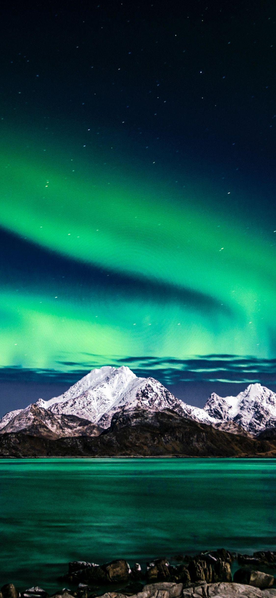 1125x2436 Download 1125x2436 wallpaper aurora borealis, green lights, sky, night, europe, iphone x 1125x2436 HD image, background, 19522